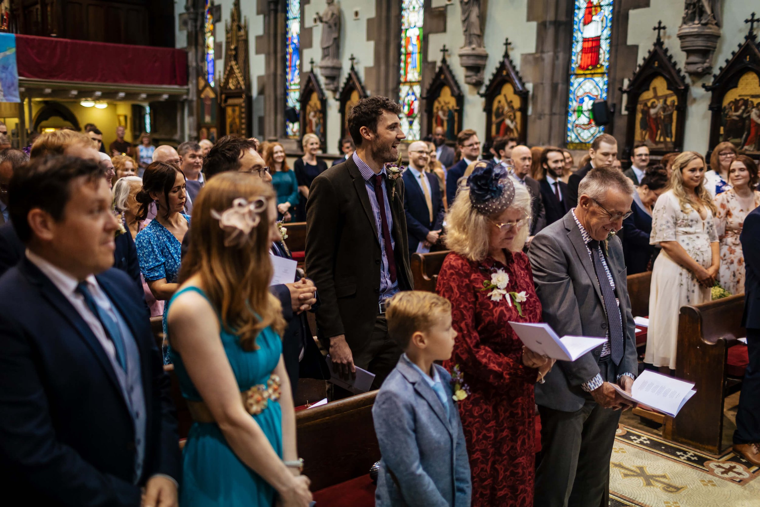 Wedding guests singing hymns in the church