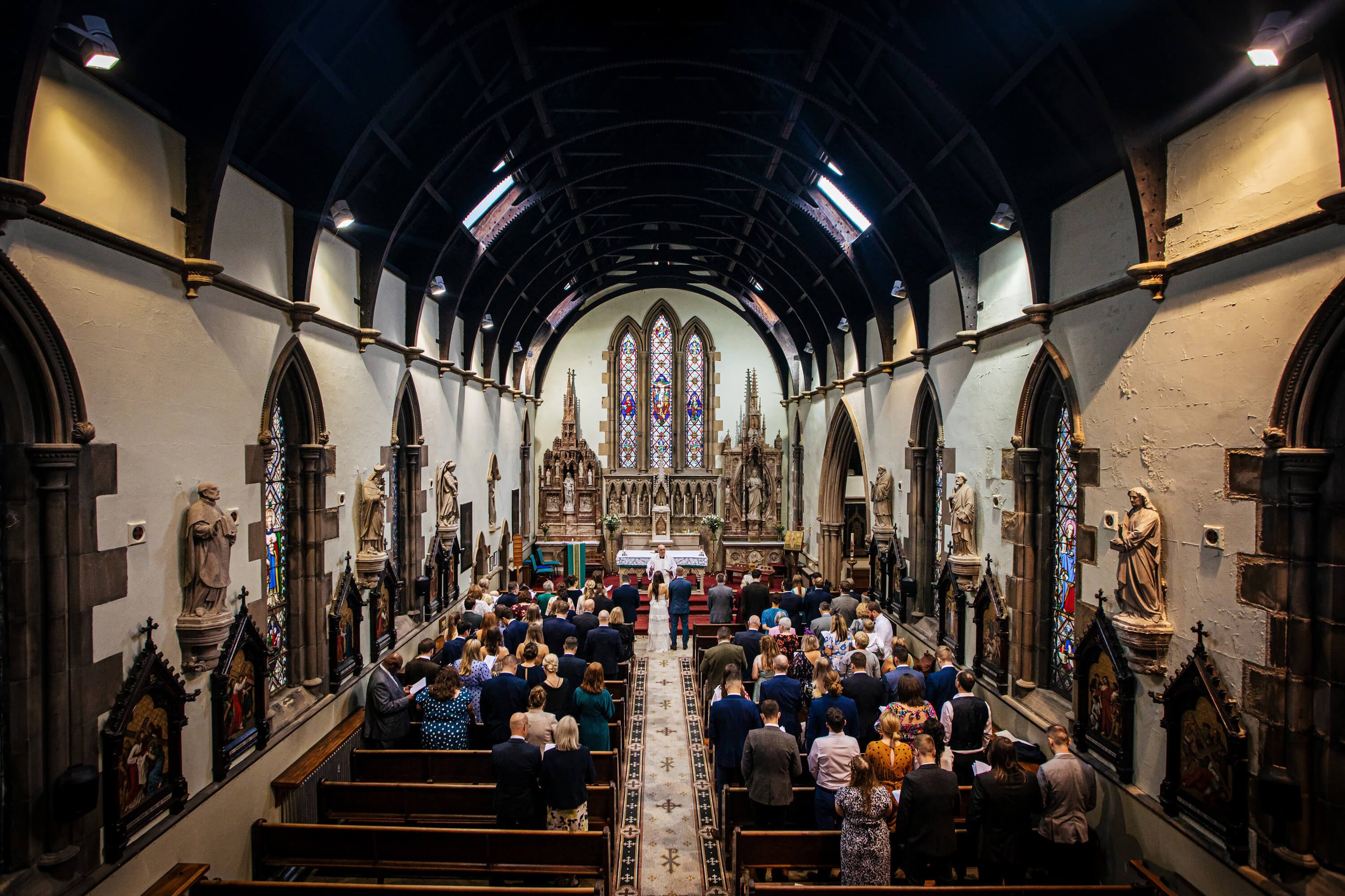 A wide shot of the church interior at a wedding in Skipton