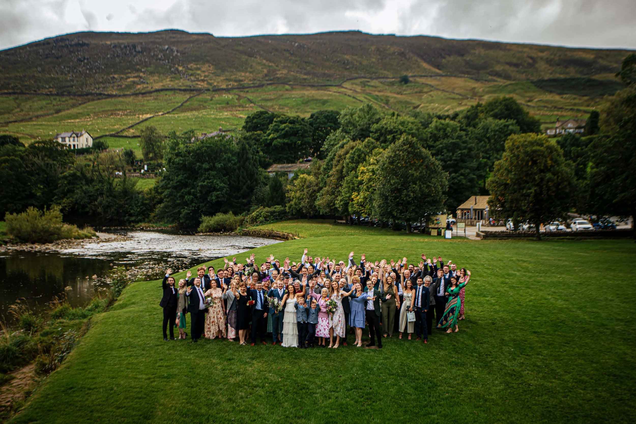 Group photo at Burnsall with the Yorkshire Dales as a backdrop