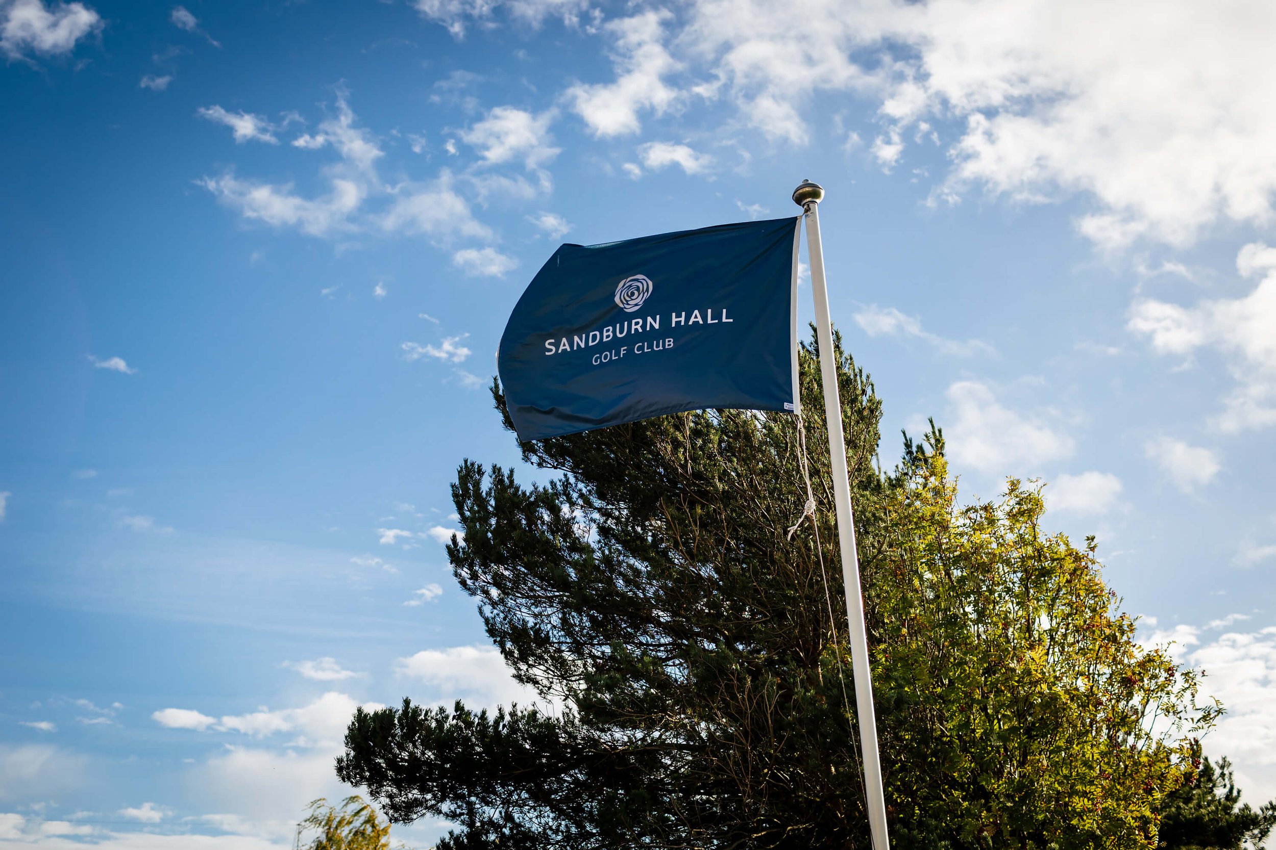 Sandburn Hall golf club flag blowing in the wind