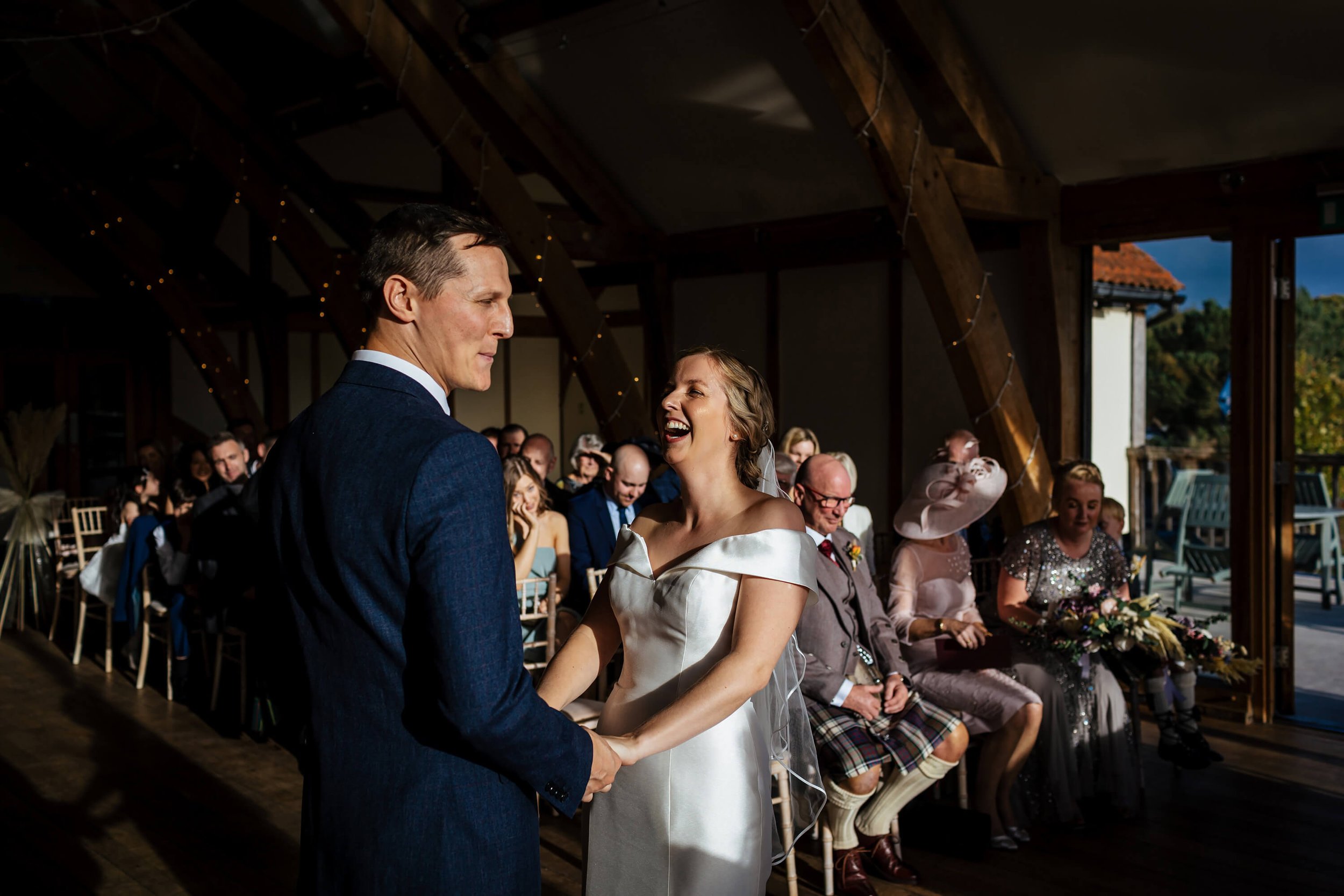 Bride laughing her way through the wedding service in York