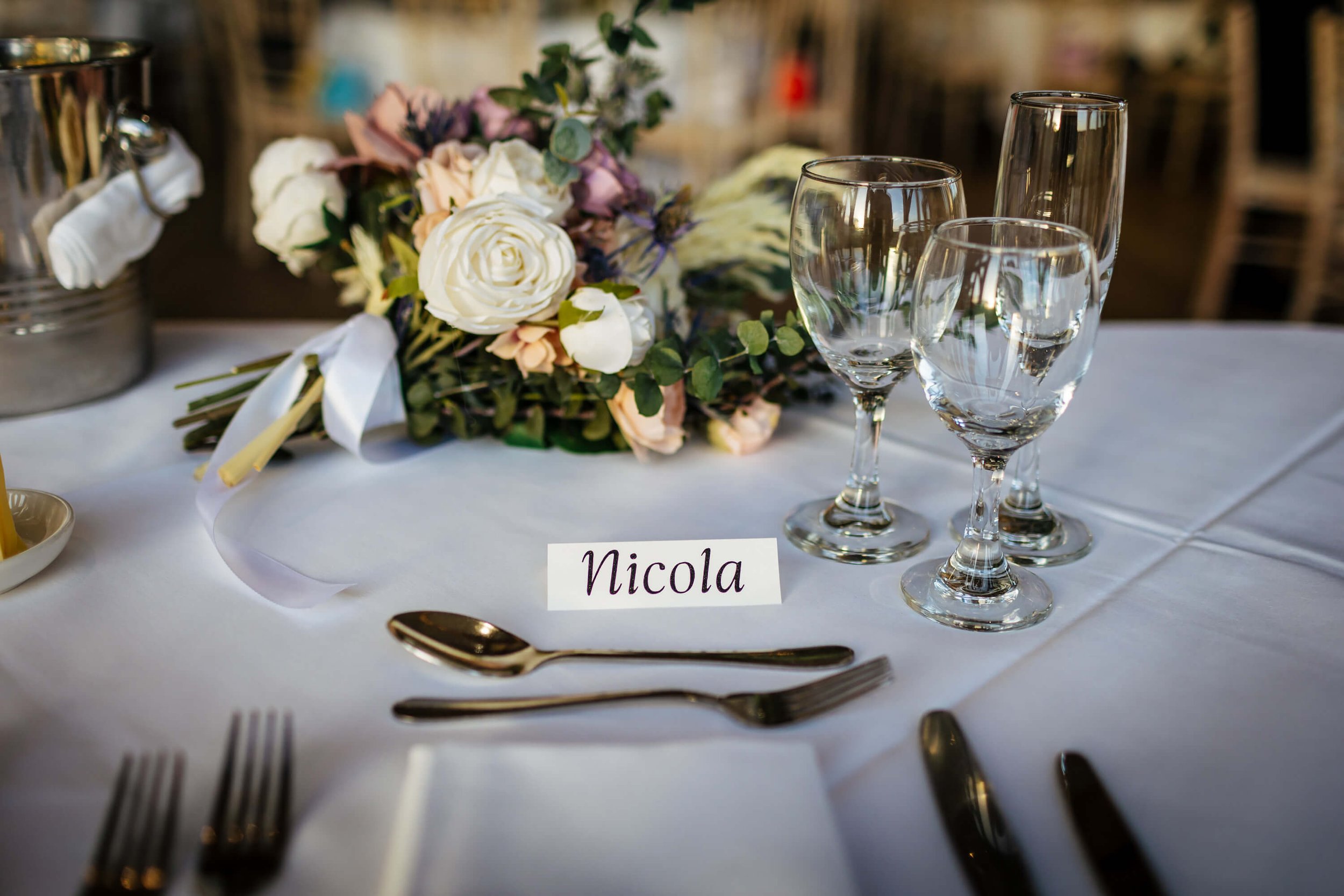 Table set up for a wedding with the Bride's name place