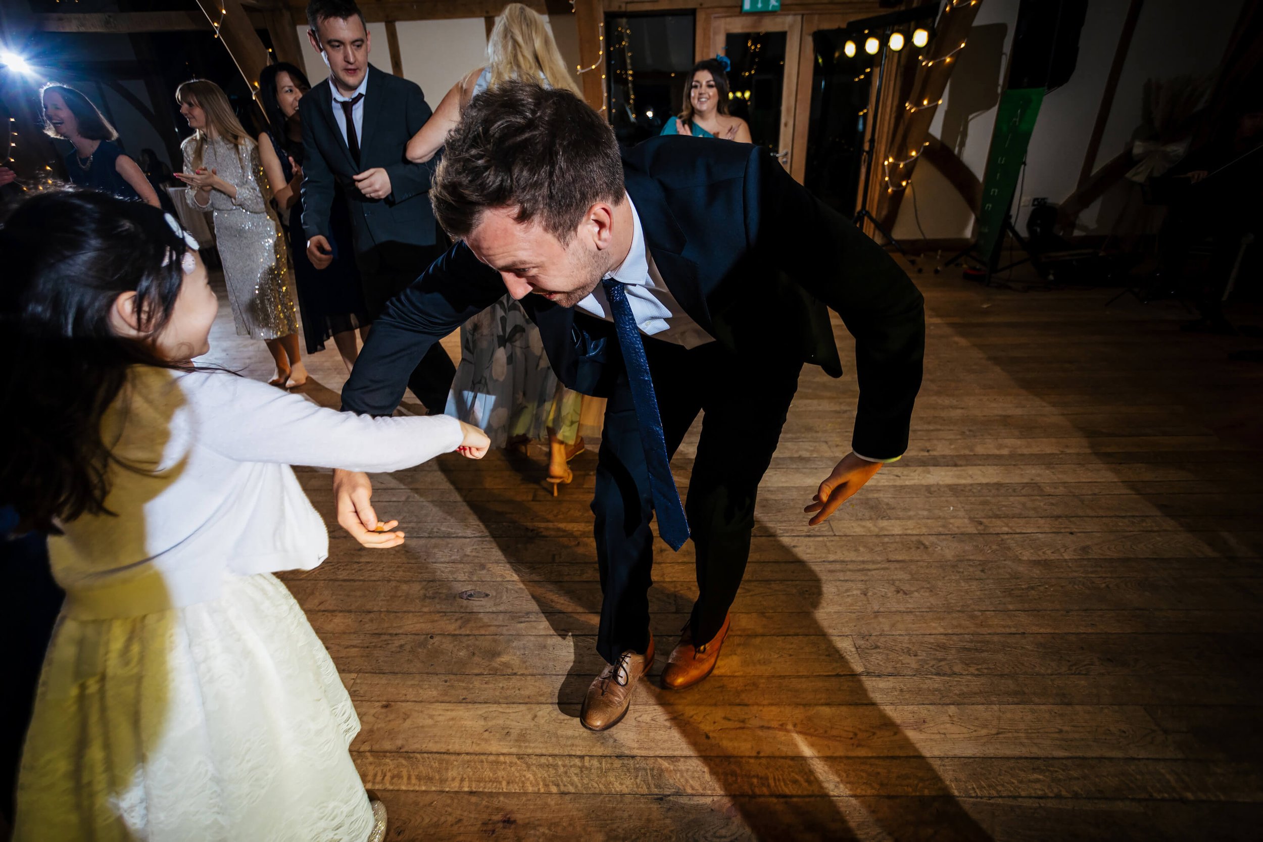 Guest dancing with a young girl at a wedding in York