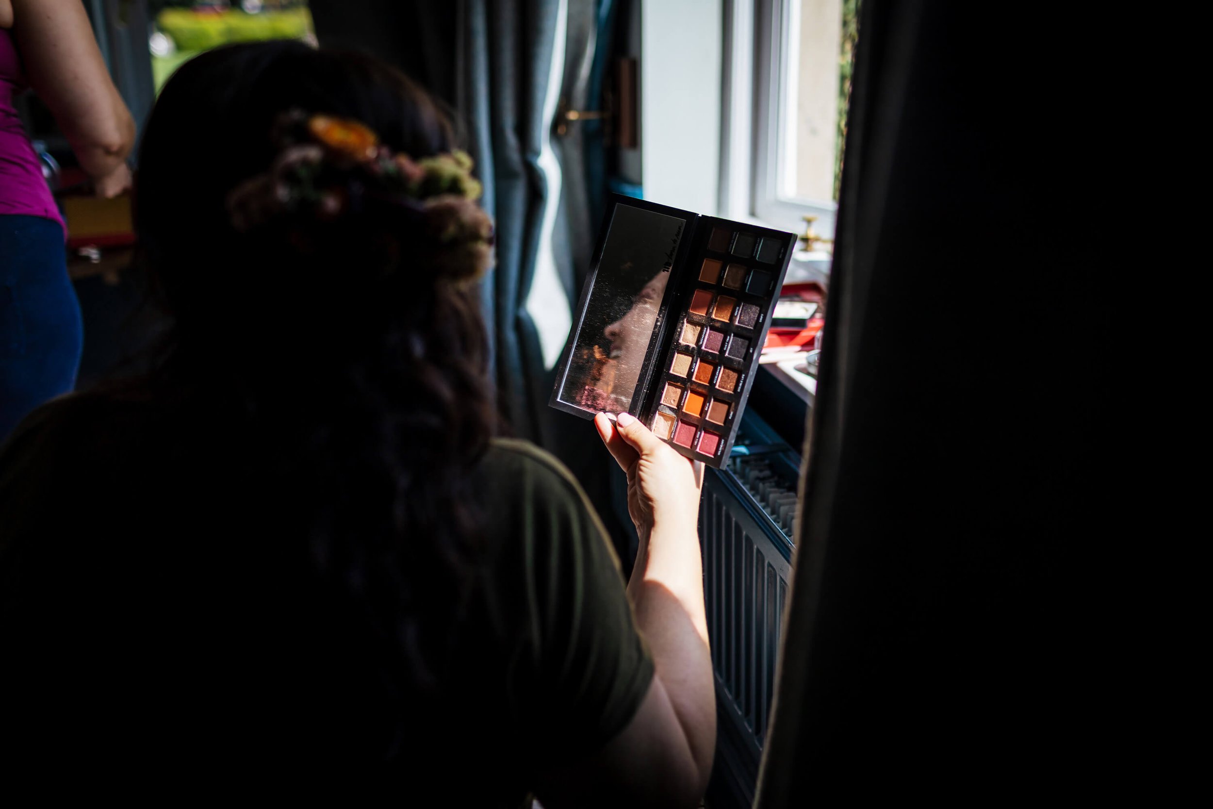 Bride holding a make up palette with different colours