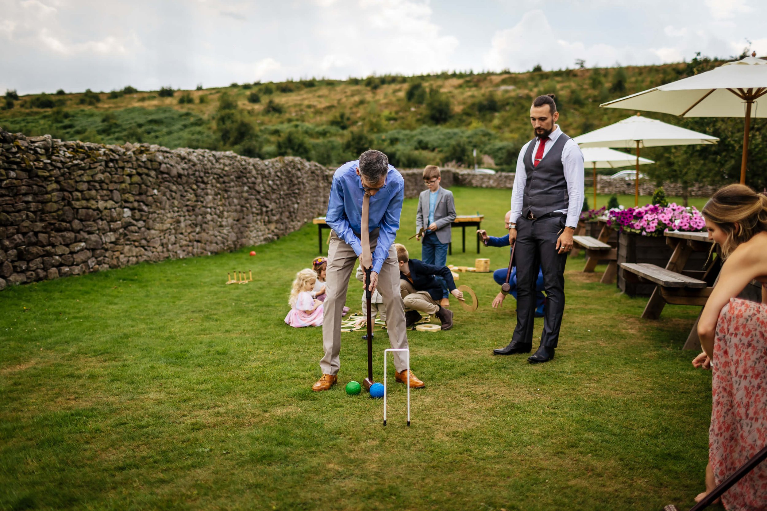 Wedding guests playing croquet on the lawn at a Yorkshire wedding