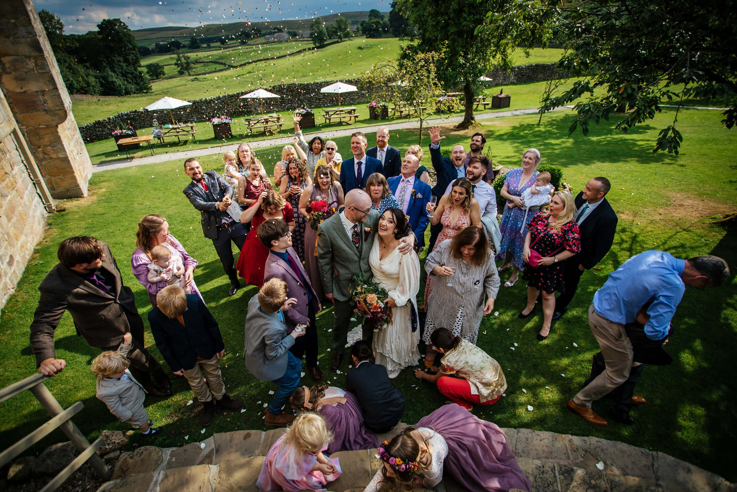 Throwing the confetti at a Barden Tower wedding
