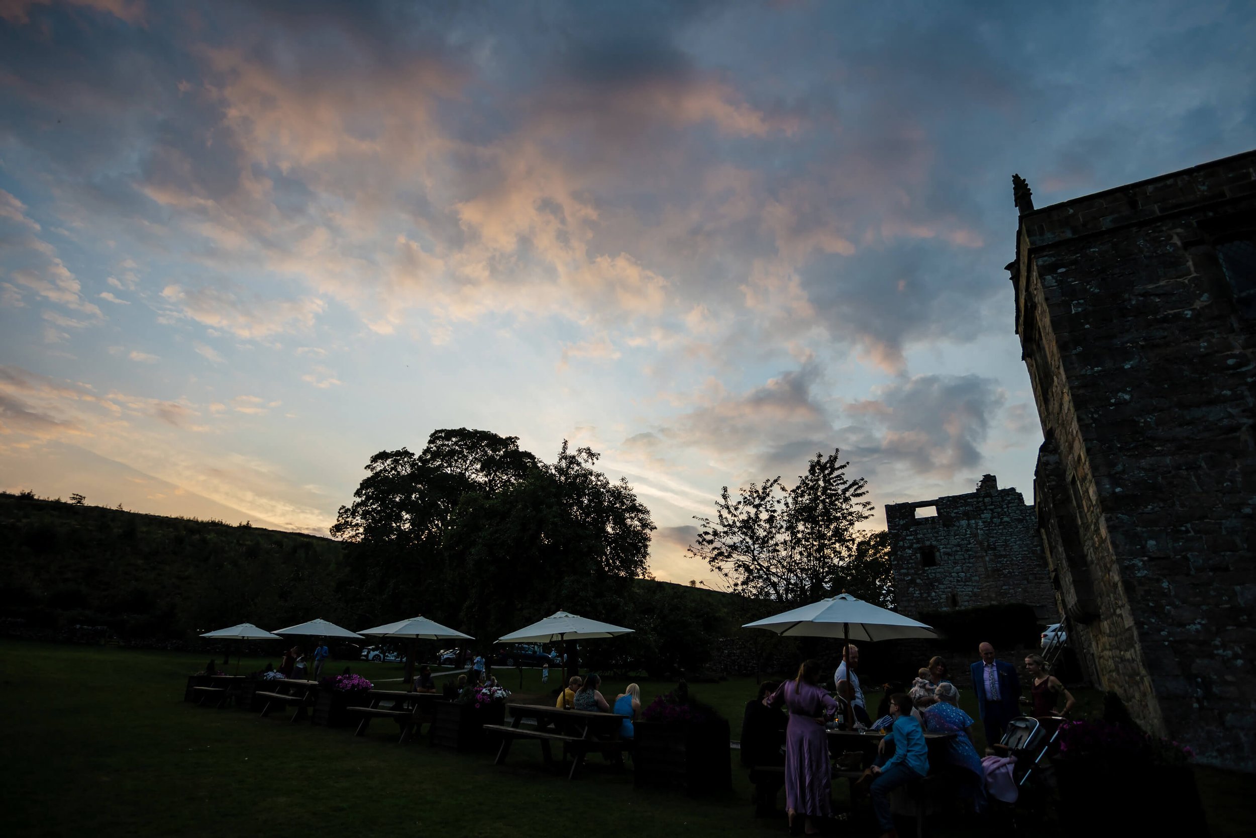 Sun setting over the hills at a Barden Tower wedding