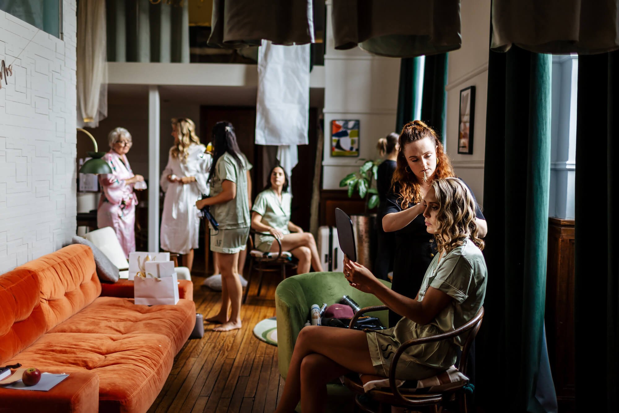 Bridesmaid having her hair done before the wedding