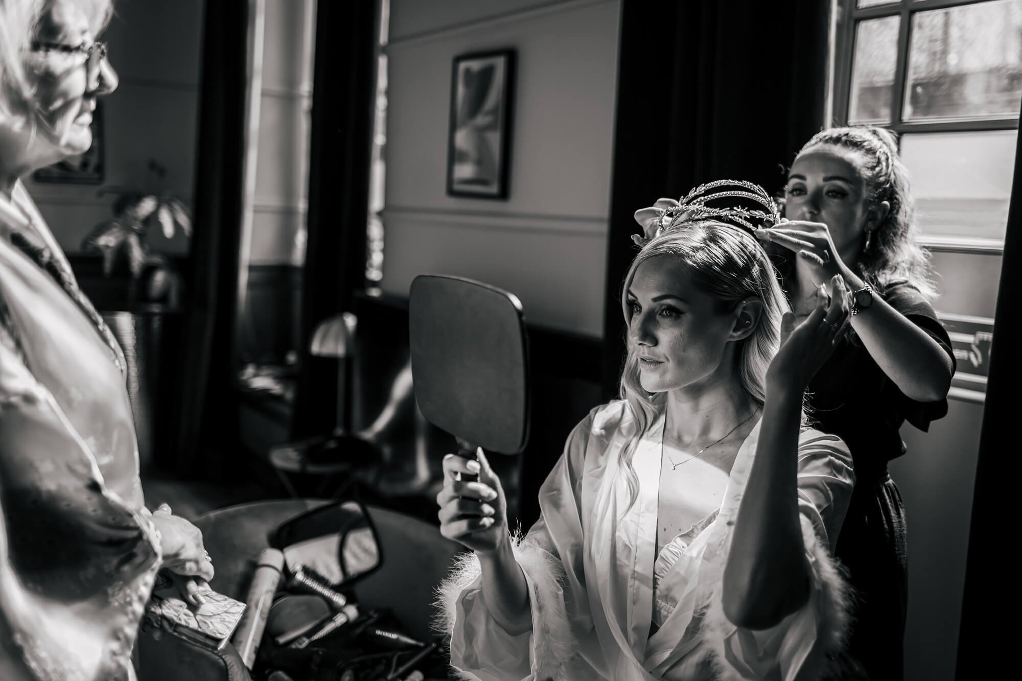 A bride in London has her hair piece attended to