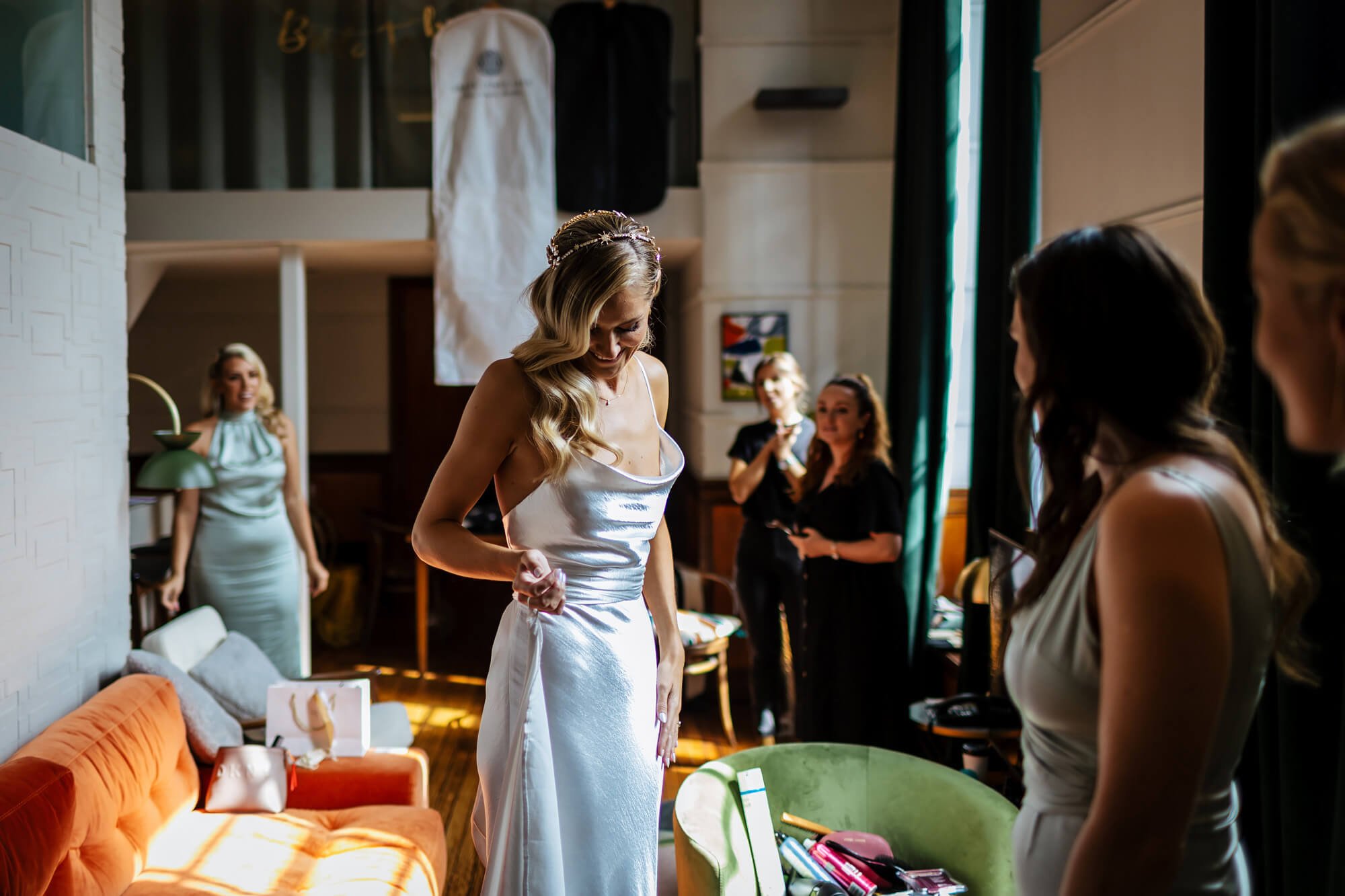 Bride gets in her dress on the wedding morning