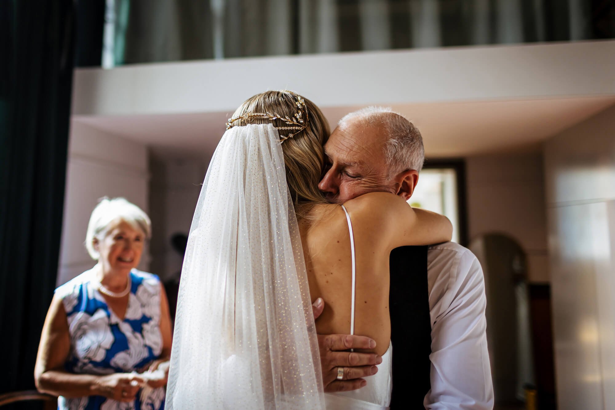 Dad sees the bride for the first time with a hug