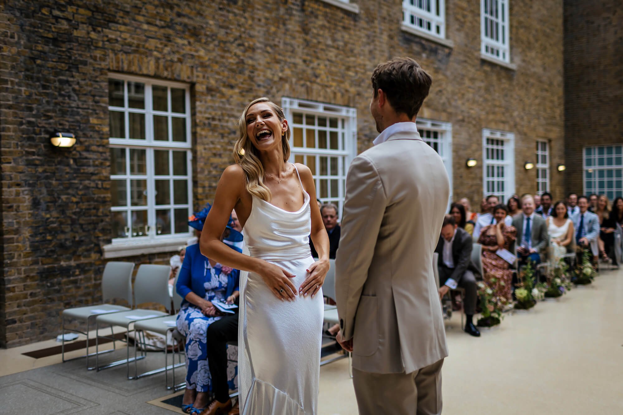 Bride laughing during the wedding ceremony