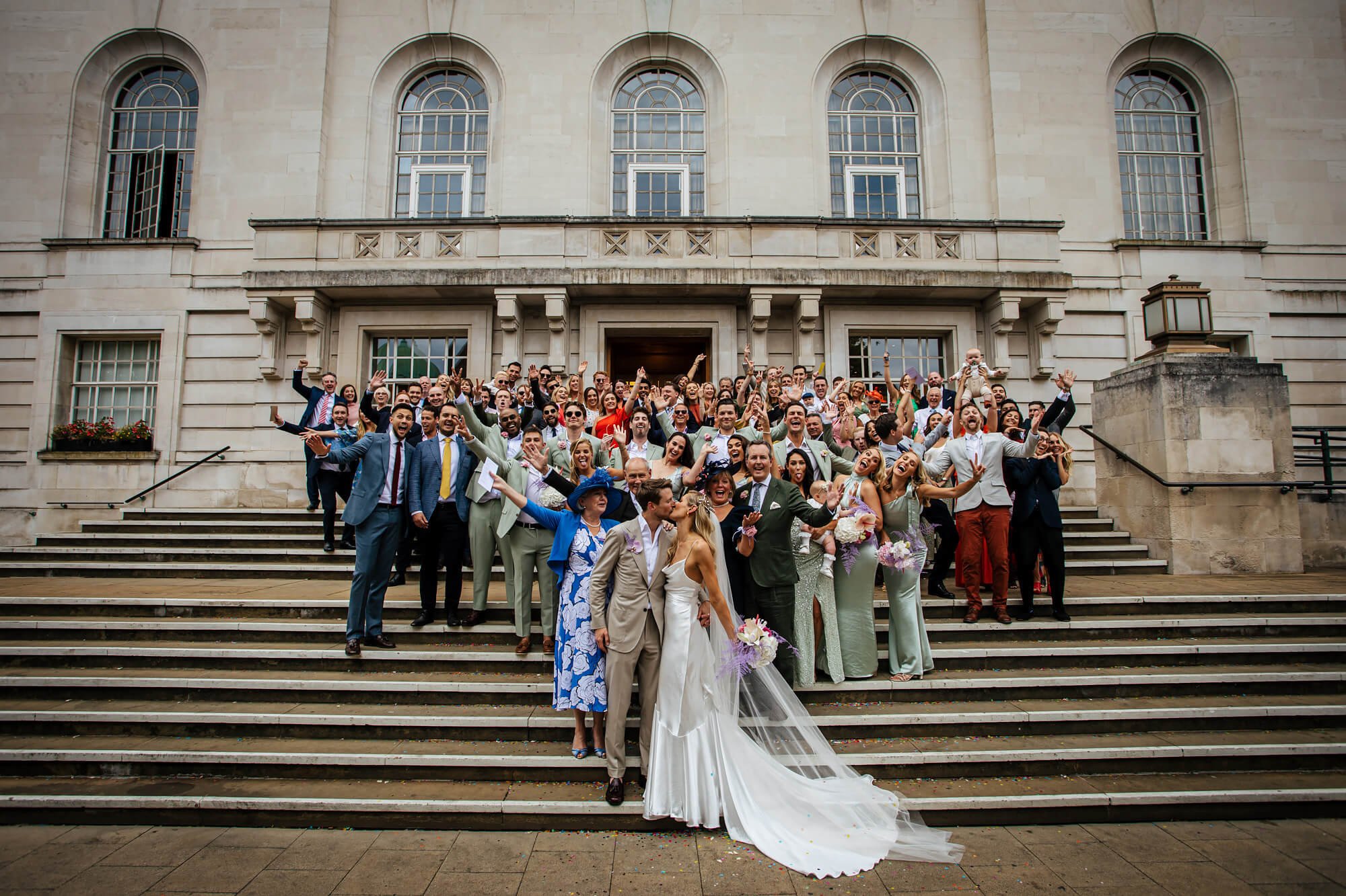 A group photo on the steps outside the wedding ceremony