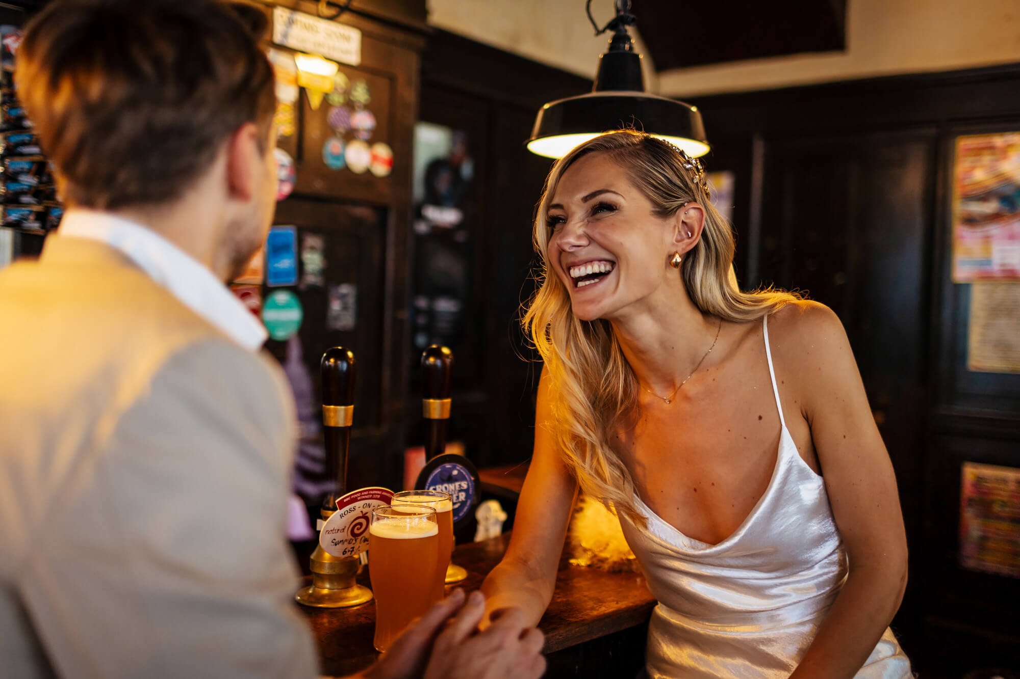 A first pint as a married couple on their wedding day