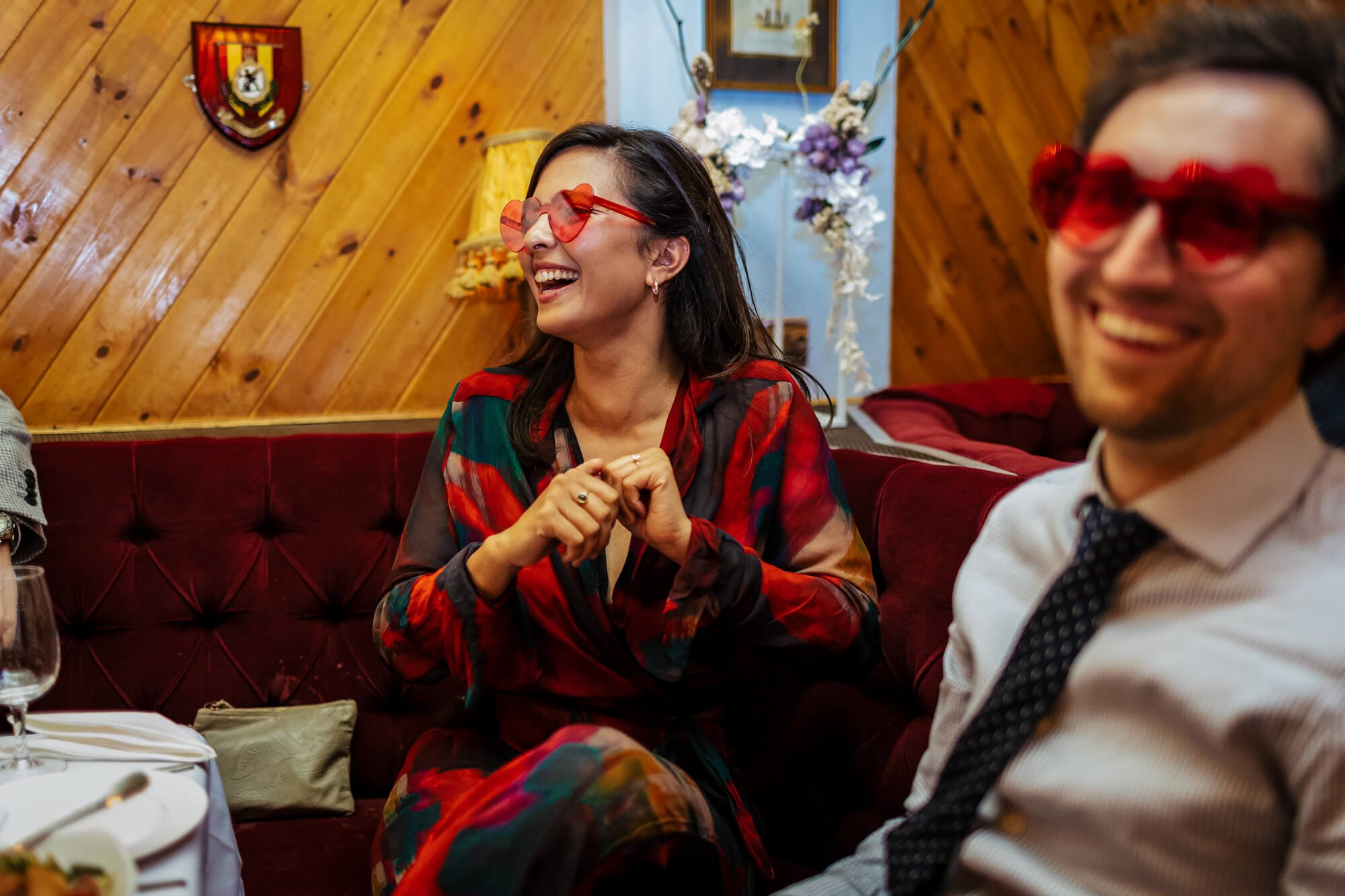 Wedding guests wearing heart sunglasses at MOTH Club