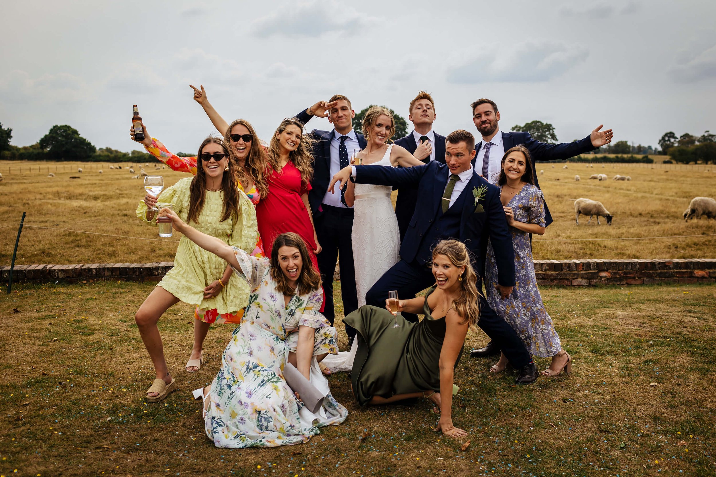 Wedding guests pose for a silly photo at the reception