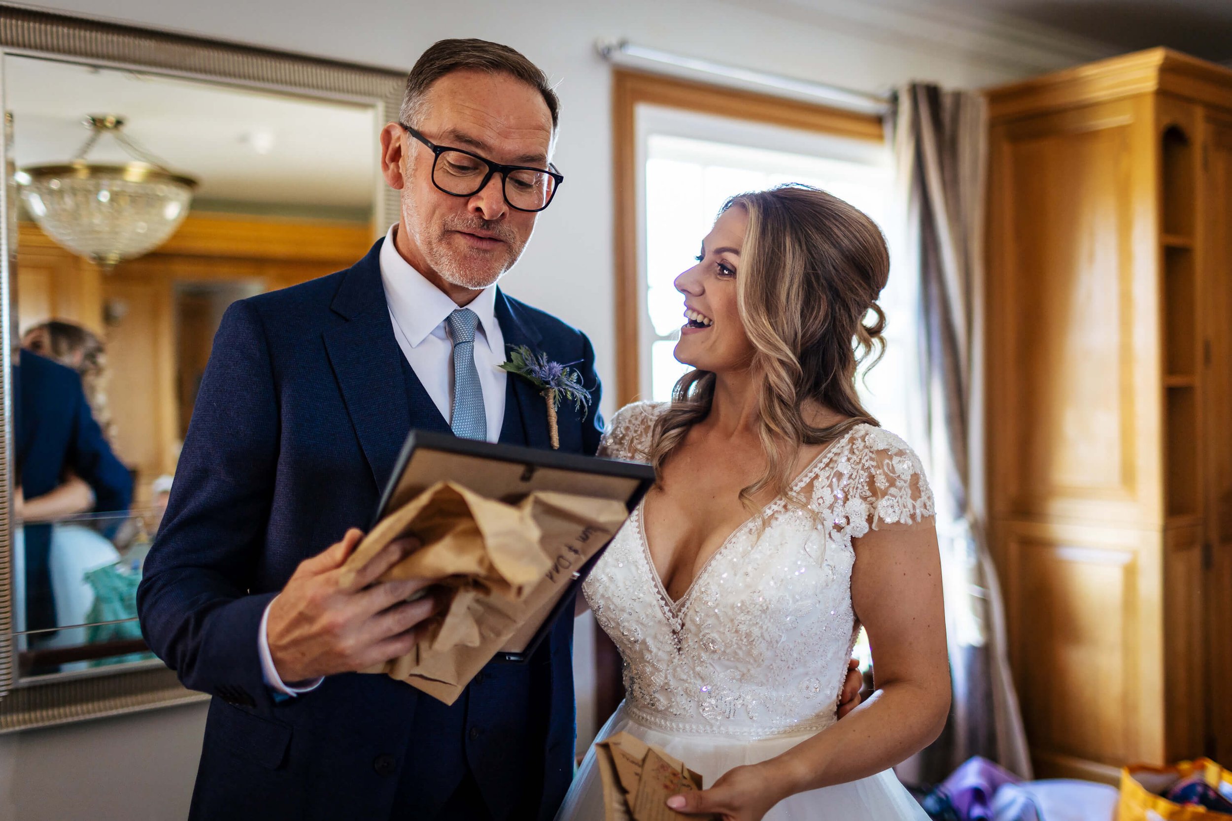 Bride gifts her father a present on the wedding morning