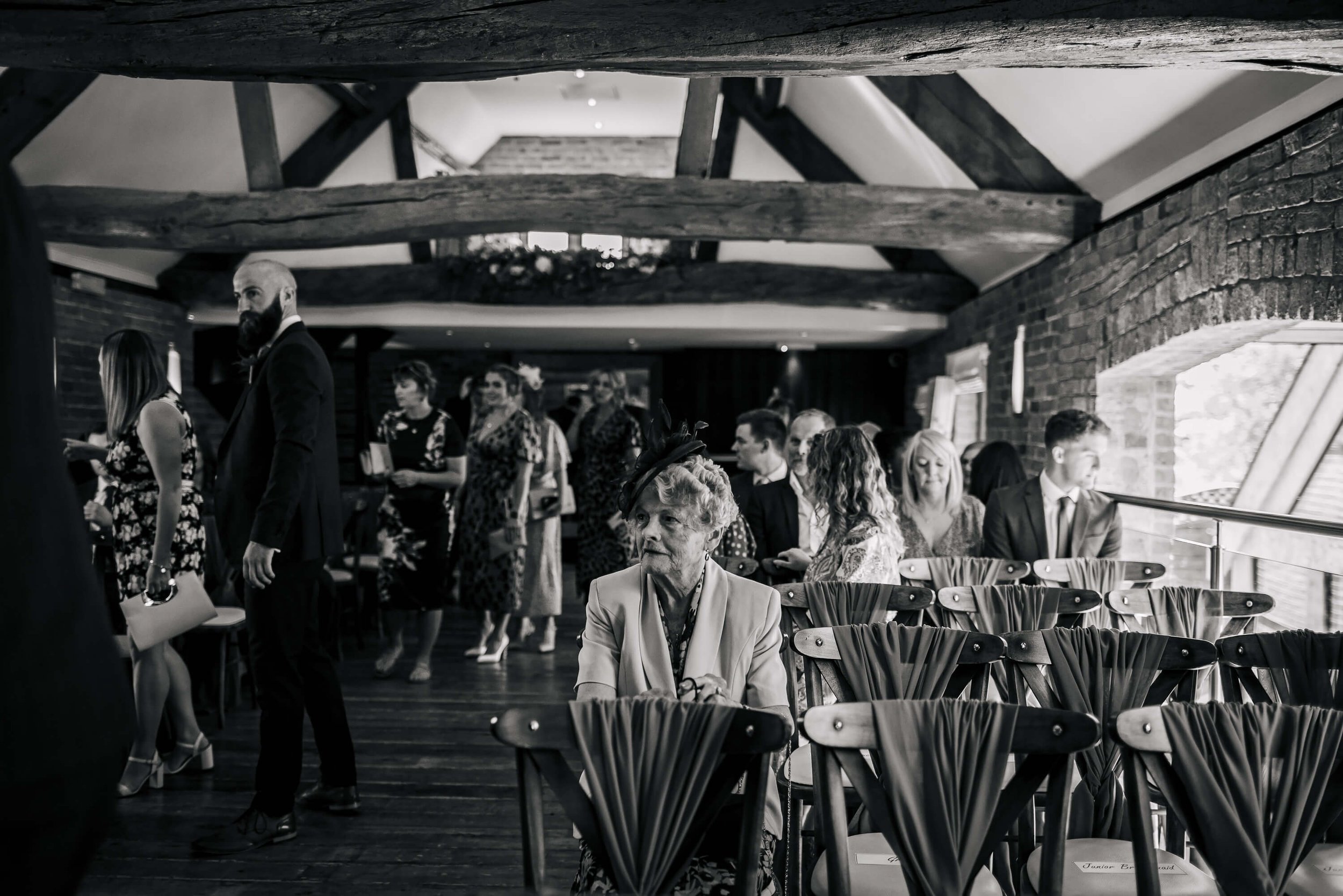 Wedding guests at the ceremony waiting for the bride