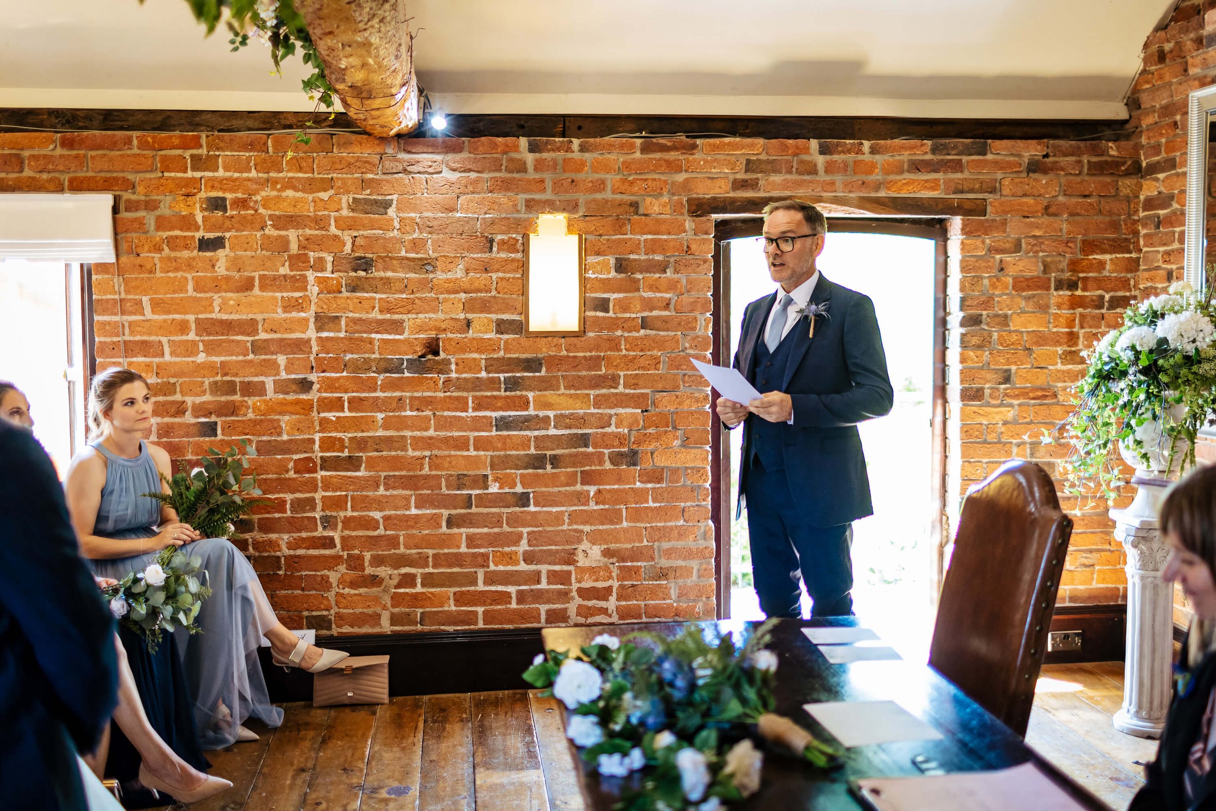 Bride's dad performs a reading during his daughter's wedding ceremony