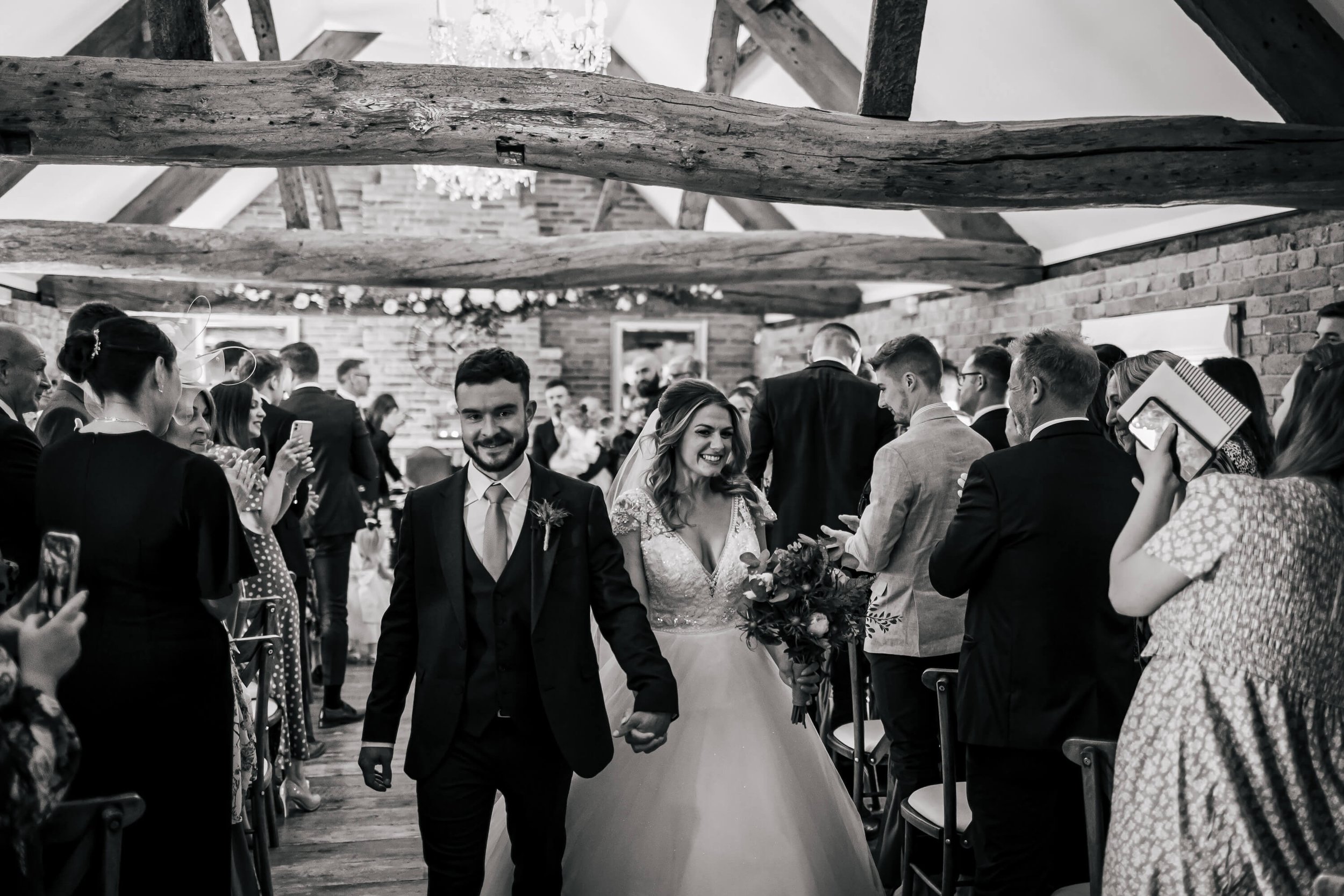 Bride and groom walking down the aisle at a Swancar Farm wedding