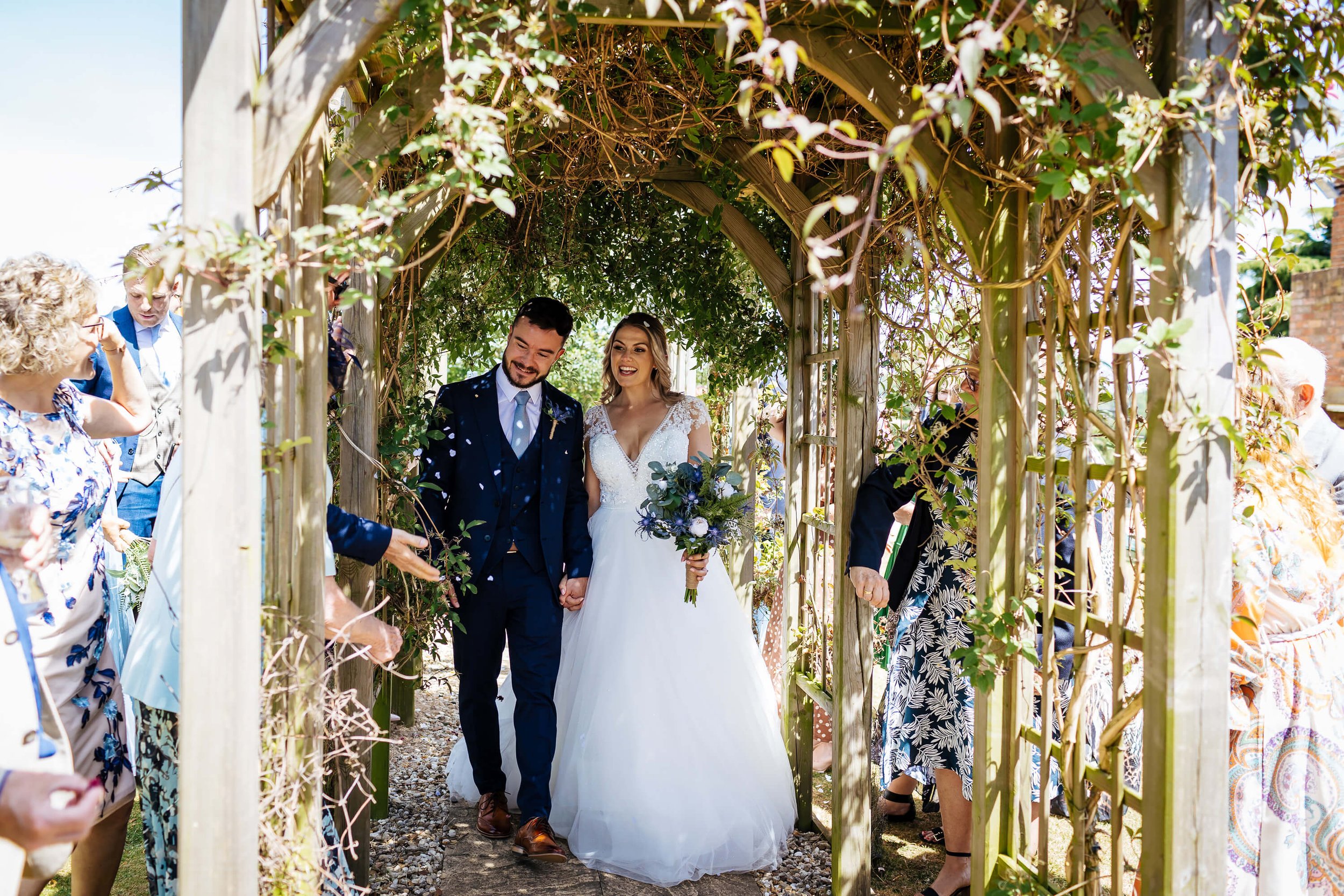 Confetti throw at a sunny wedding in Nottinghamshire