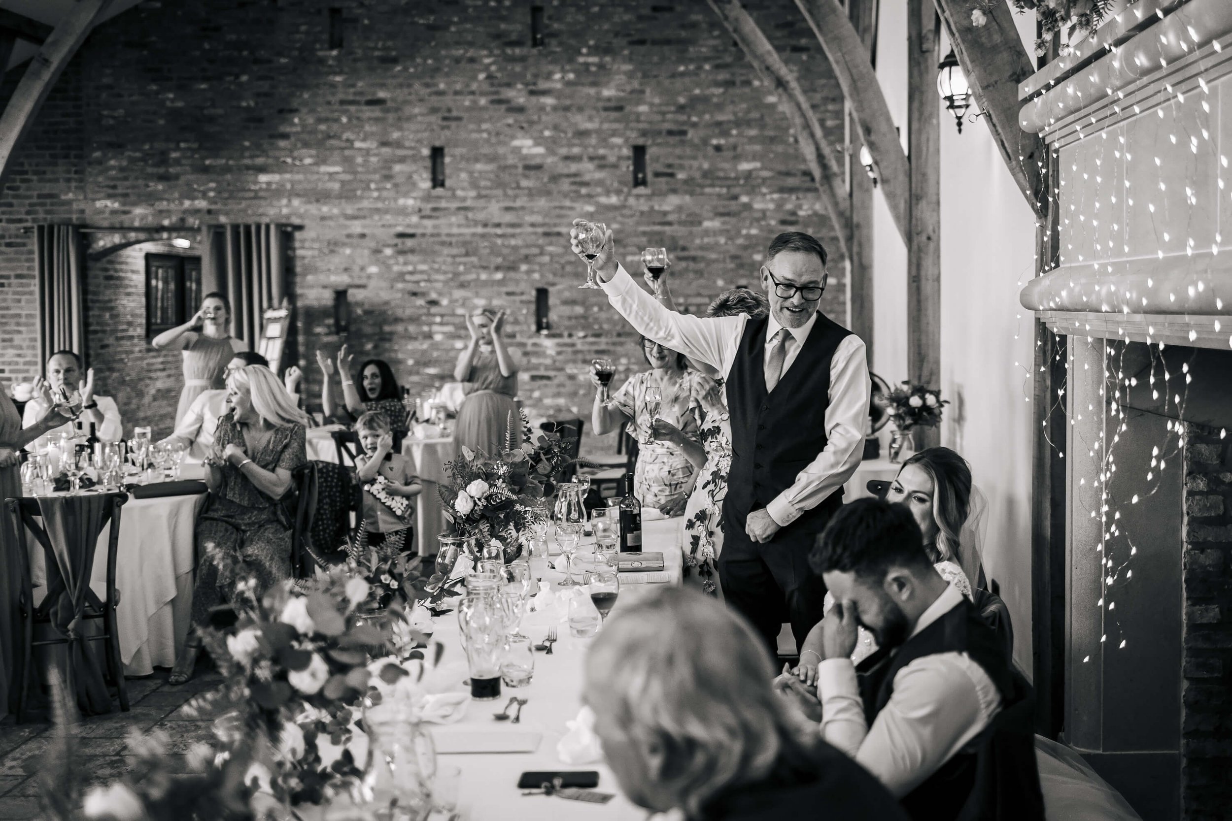 Father of the bride toasting the couple at a Swancar Farm wedding