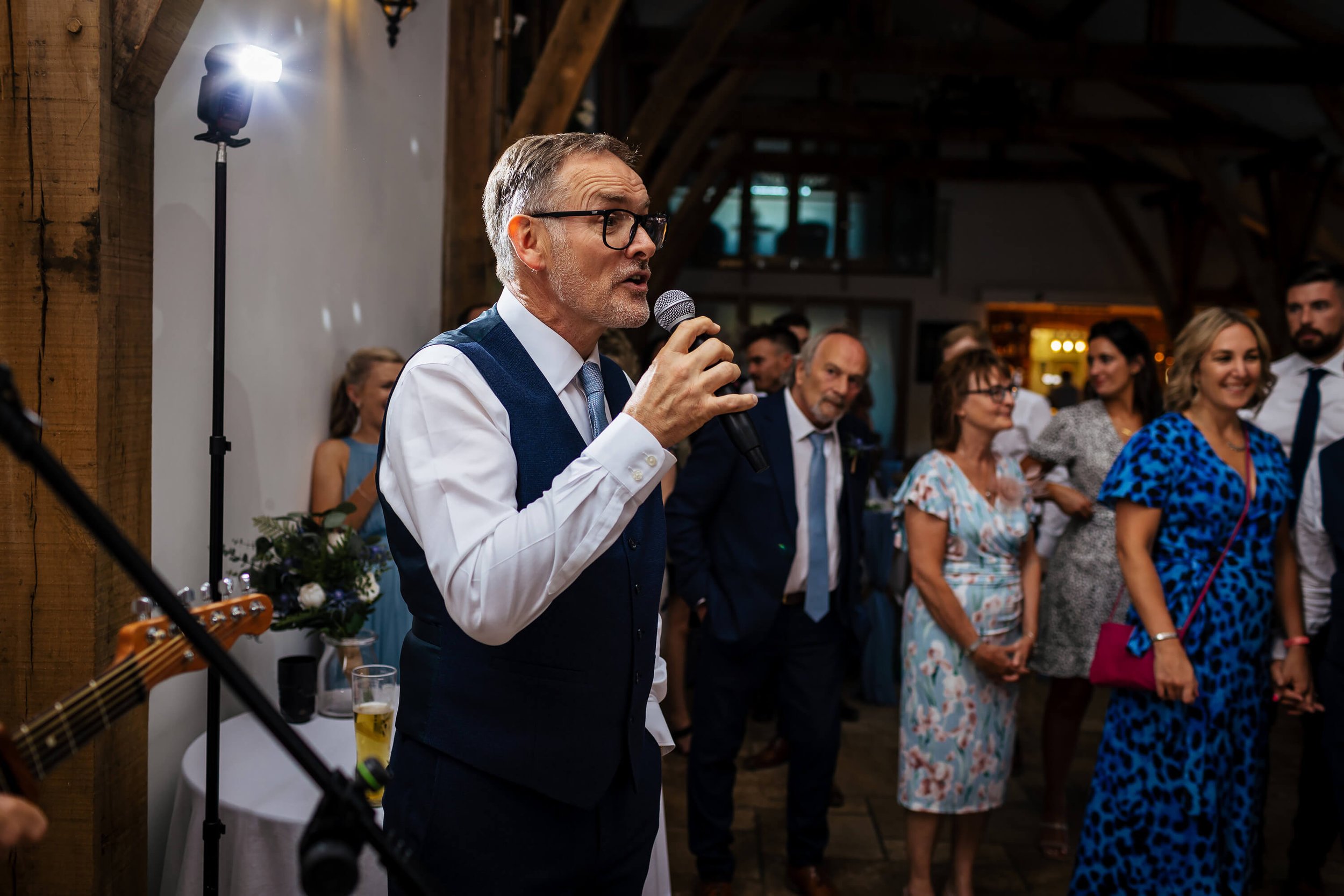 Father of the bride singing to his daughter at her wedding