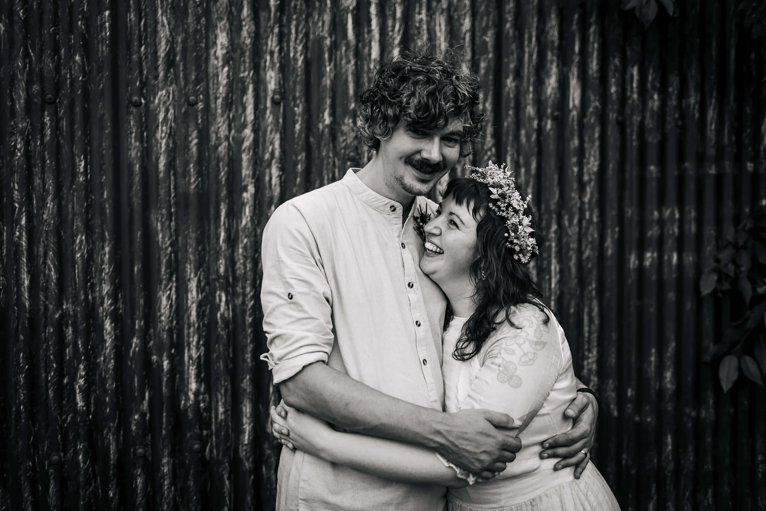 A black an white portrait of the bride and groom on their wedding day
