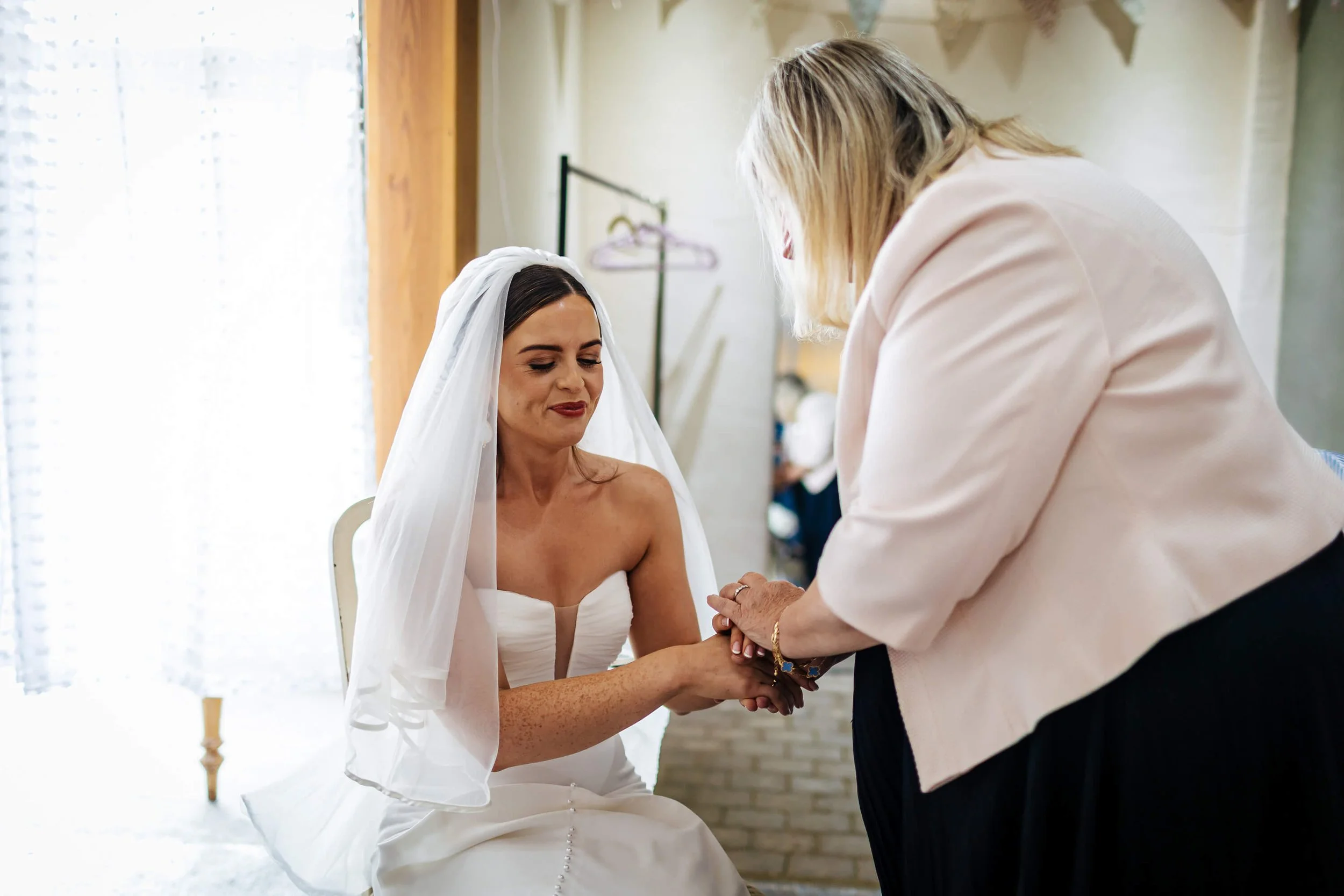 A nervous bride is calmed before the ceremony