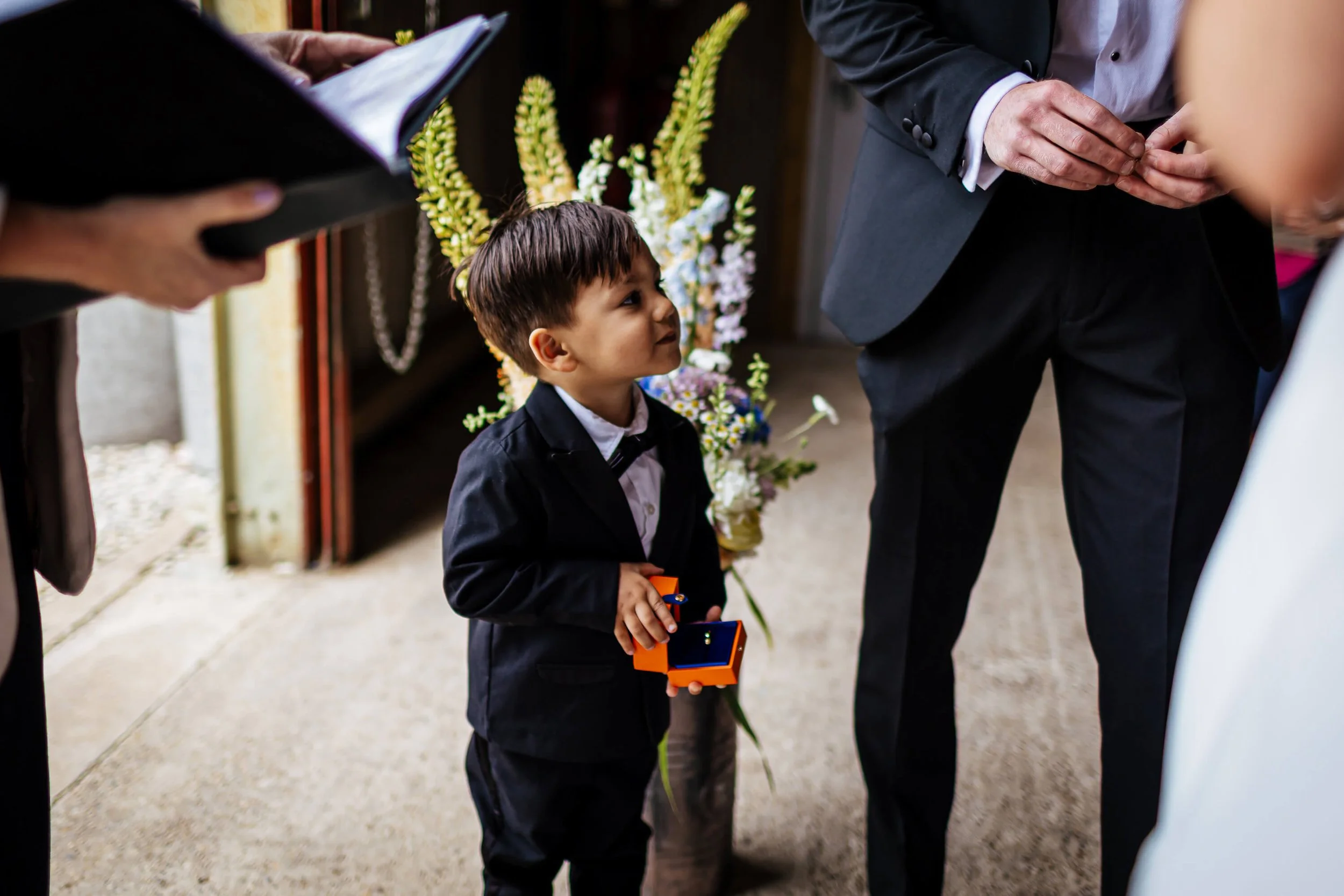 A young boy acts as the ring bearer for the wedding in Yorkshire
