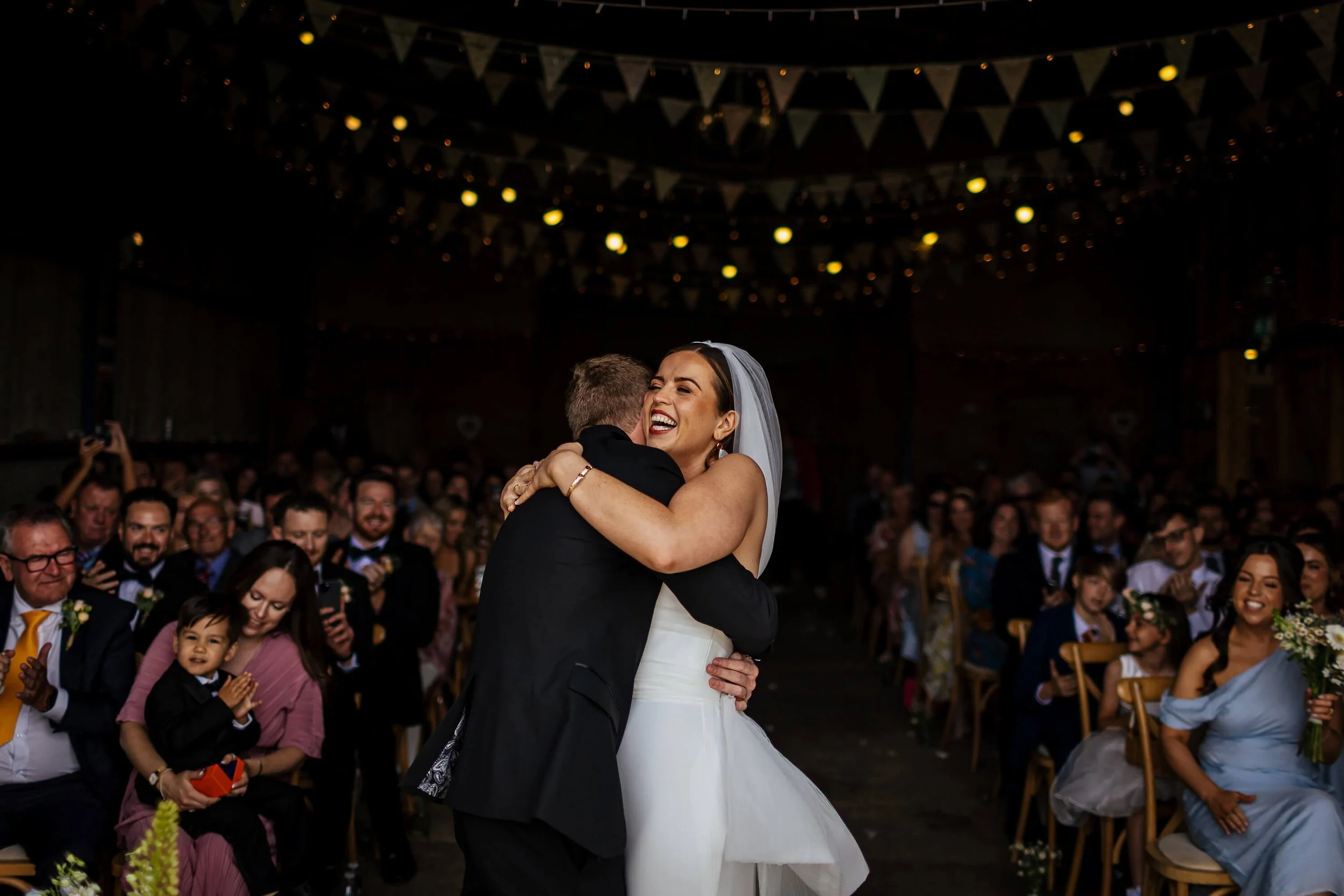 Bride and groom hug at their wedding at Berts Barrow