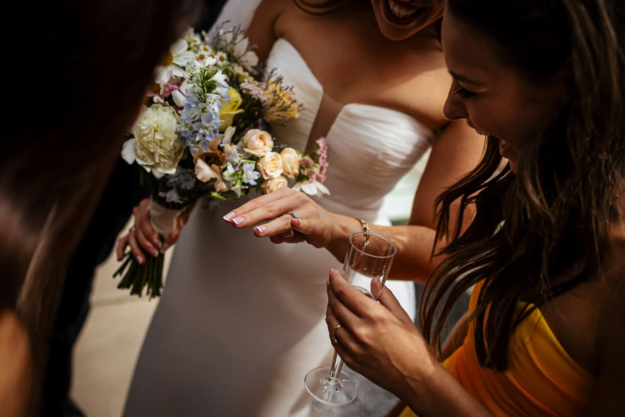 Guests inspecting the wedding ring after the ceremony