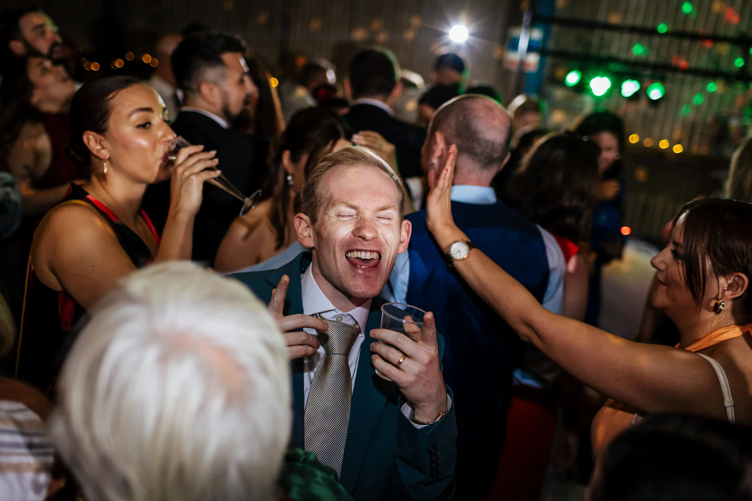 Wedding guests dancing in the evening 