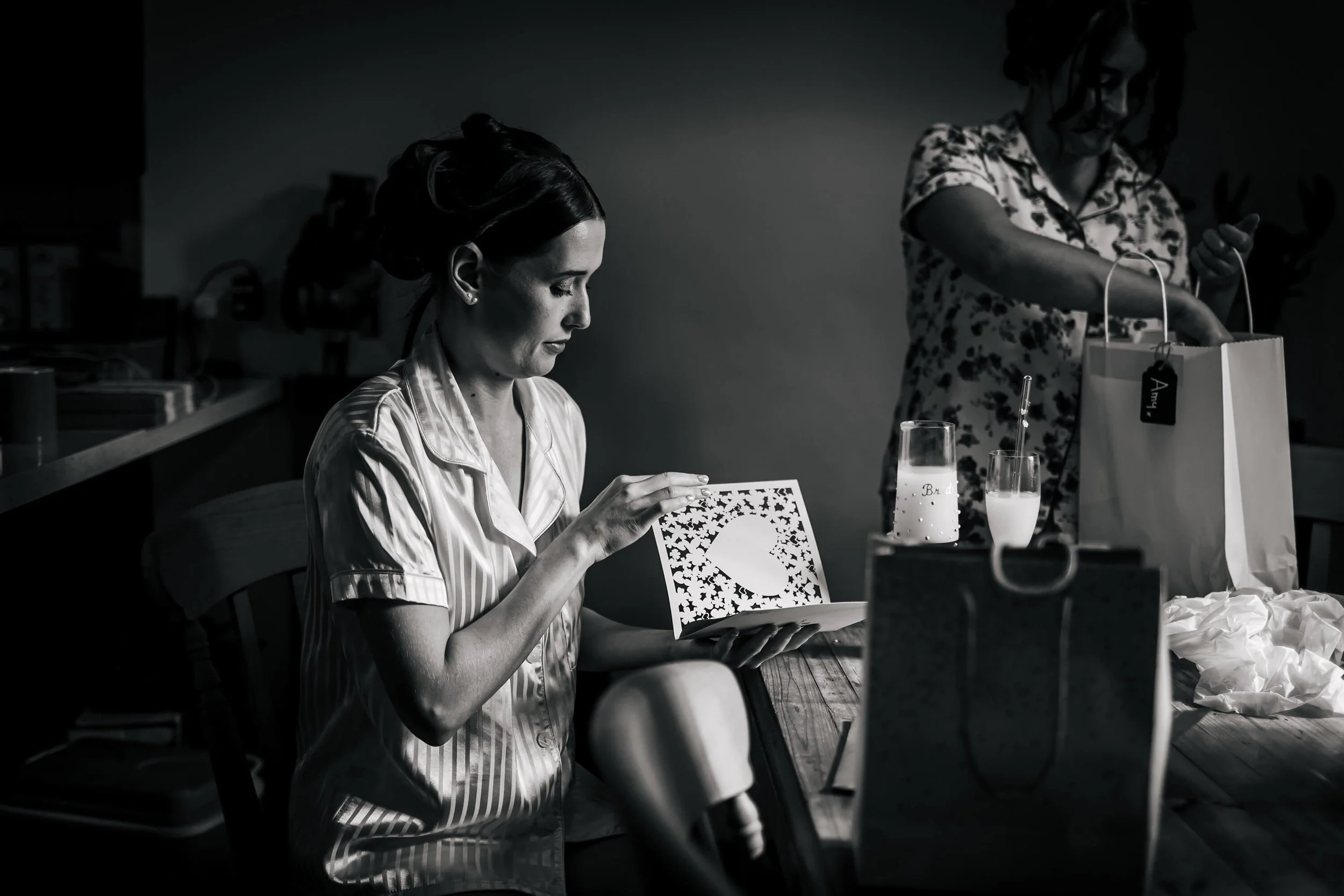 Bride opening a card on her wedding morning