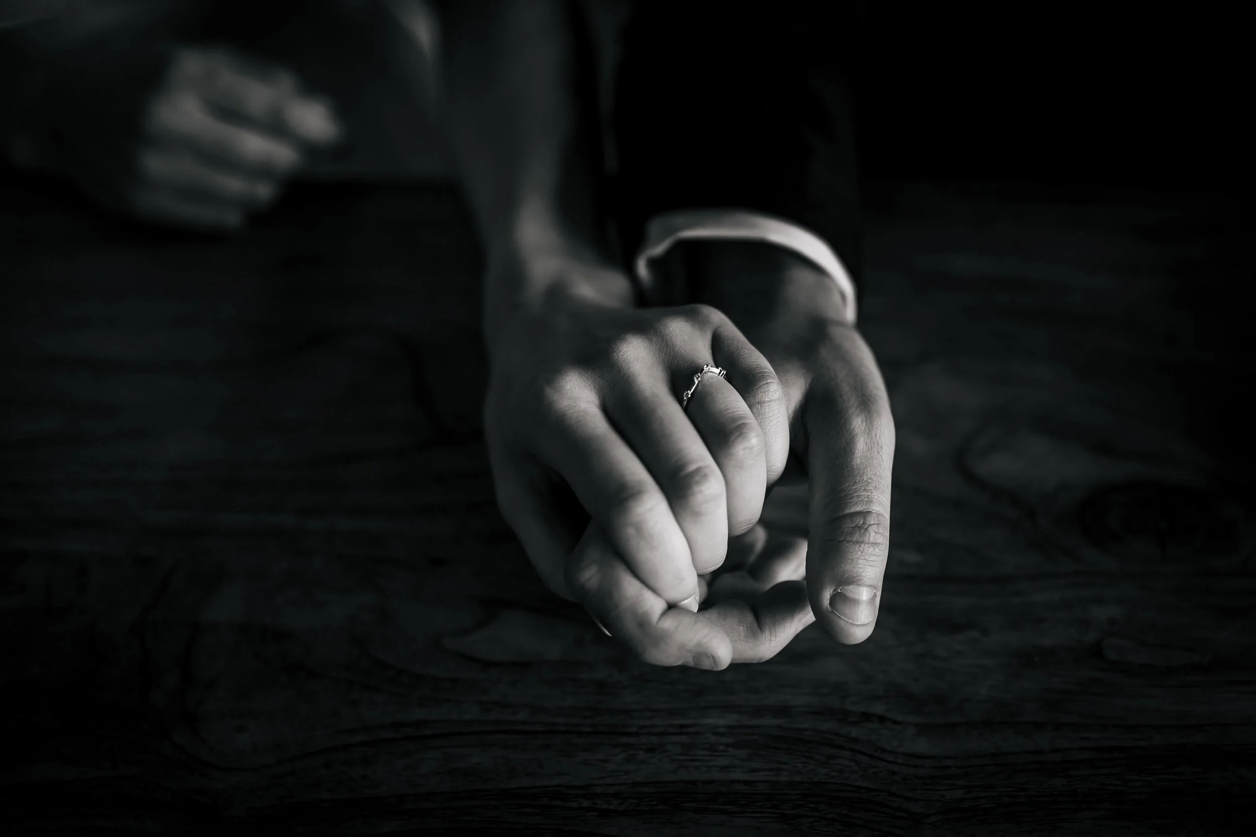 Close up of the couples' hands wearing their wedding rings