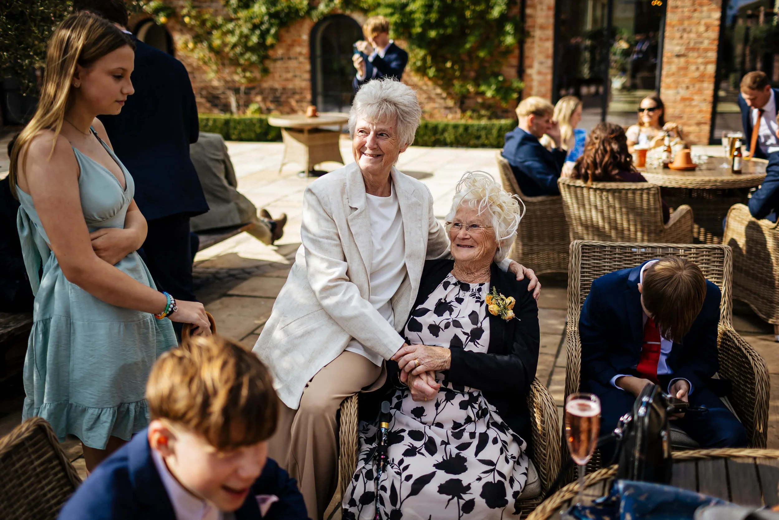 Two grandmothers enjoying the wedding