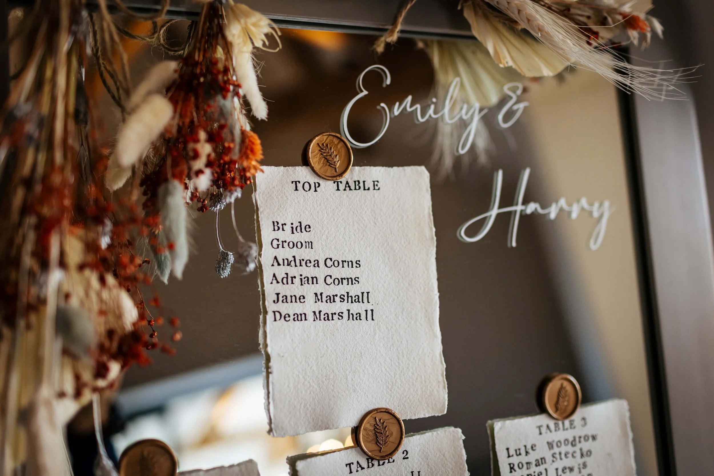 Seating plan against a mirror for a wedding