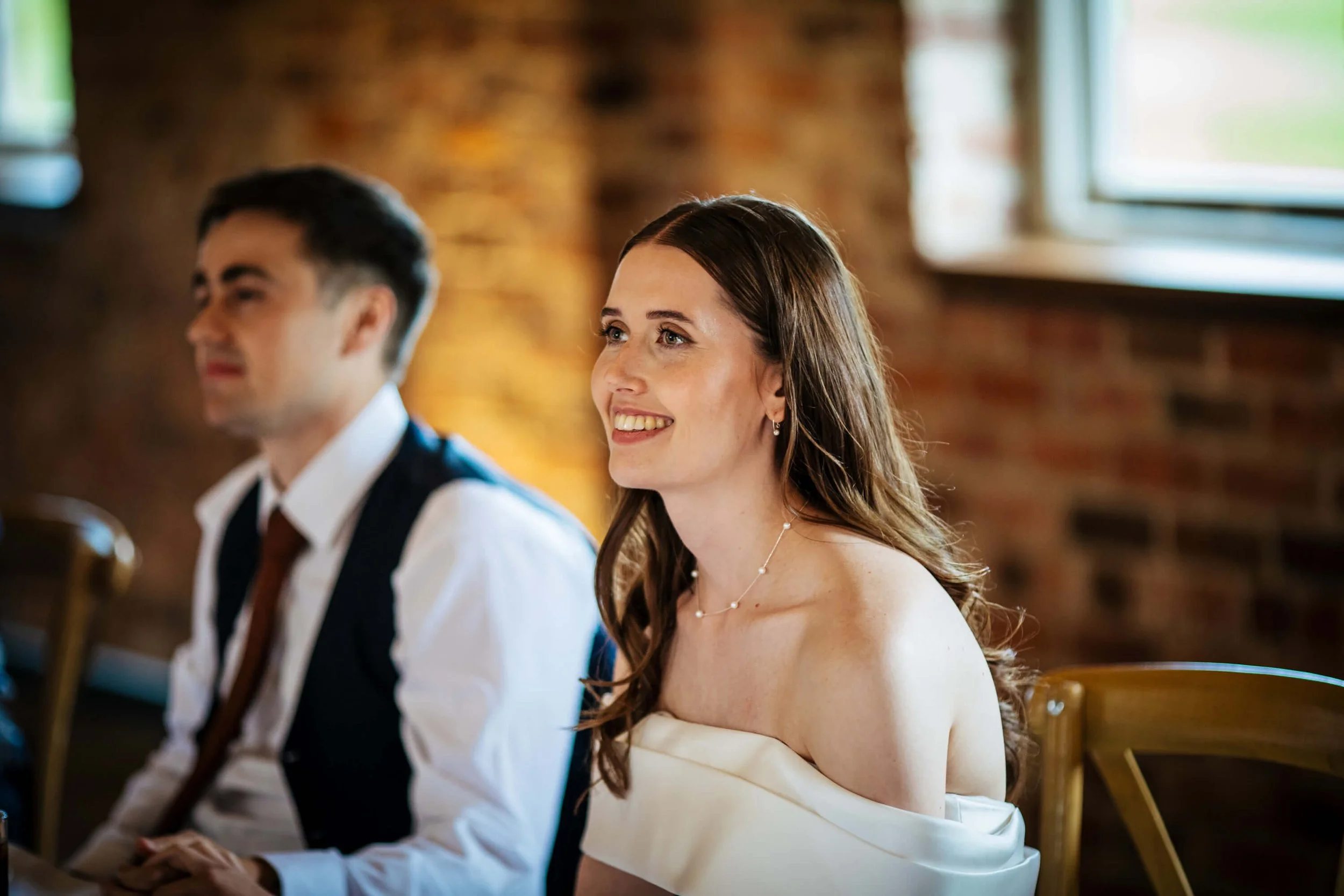 Smile smiling as she reacts to her father's speech