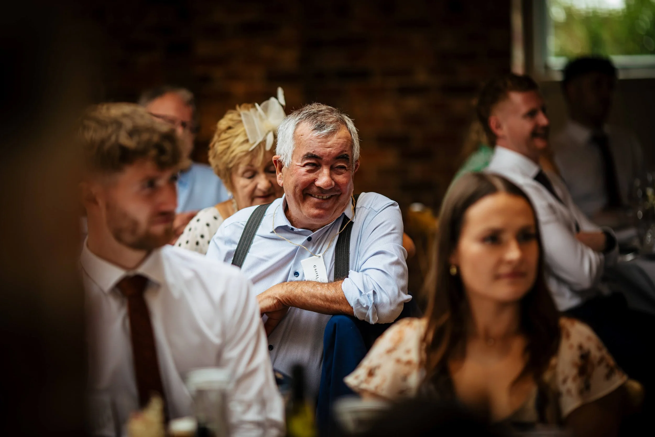 Wedding guests look on during the speeches