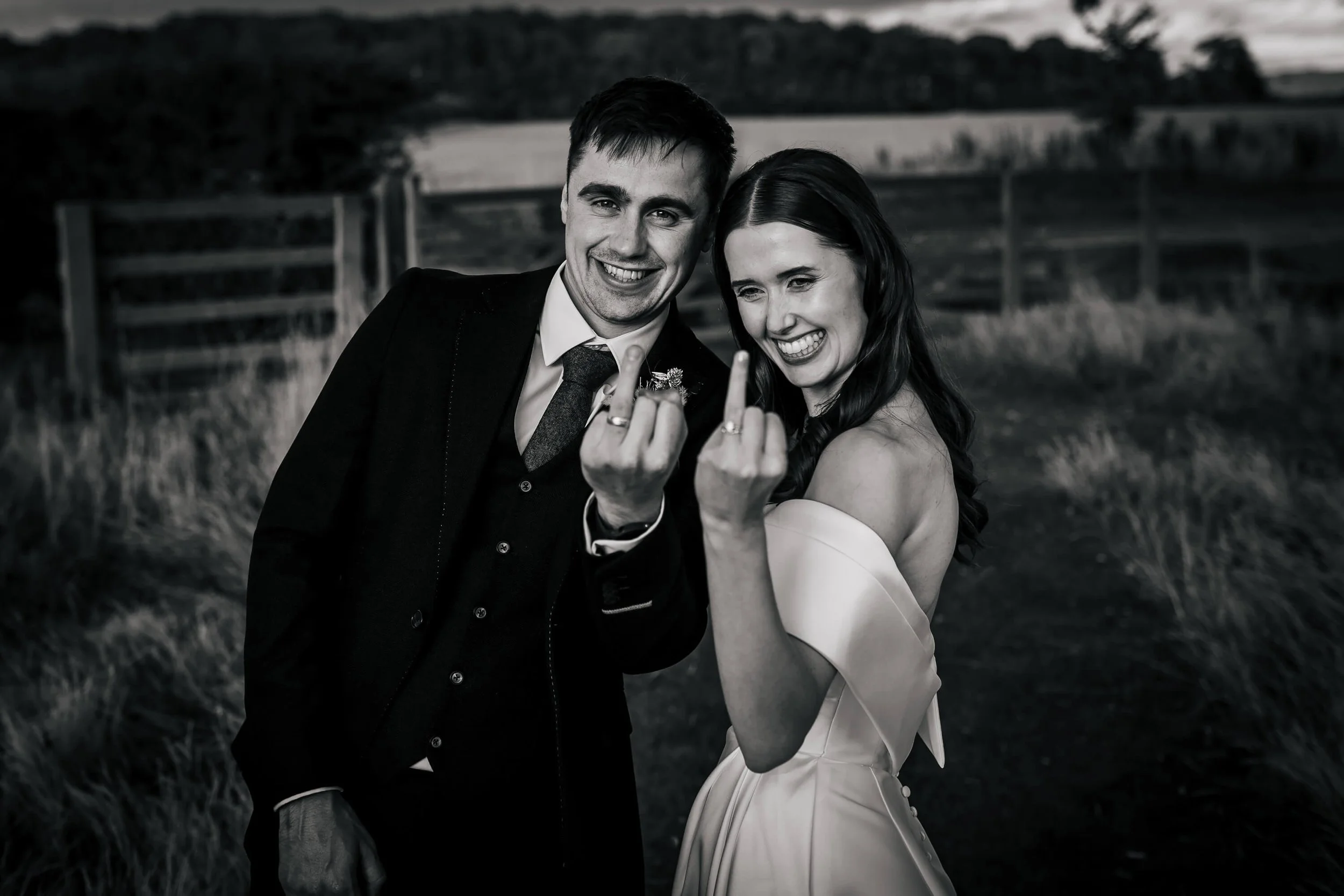 Bride and groom showing off their new wedding rings