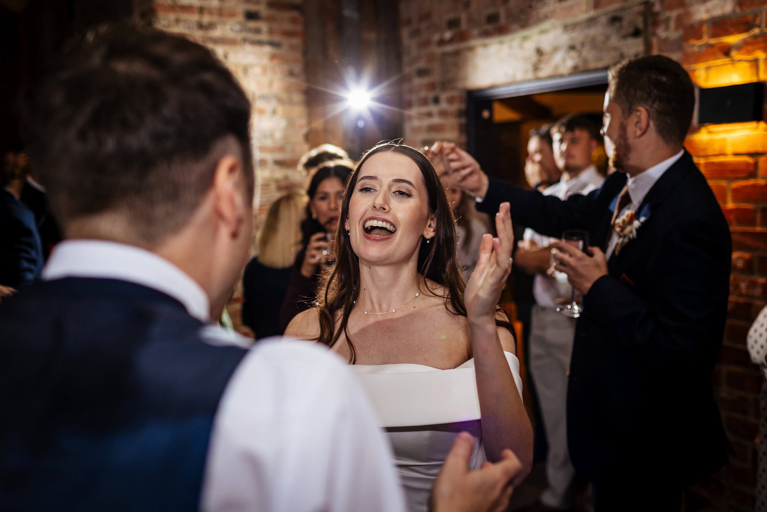 Bride dancing at her wedding with the guests