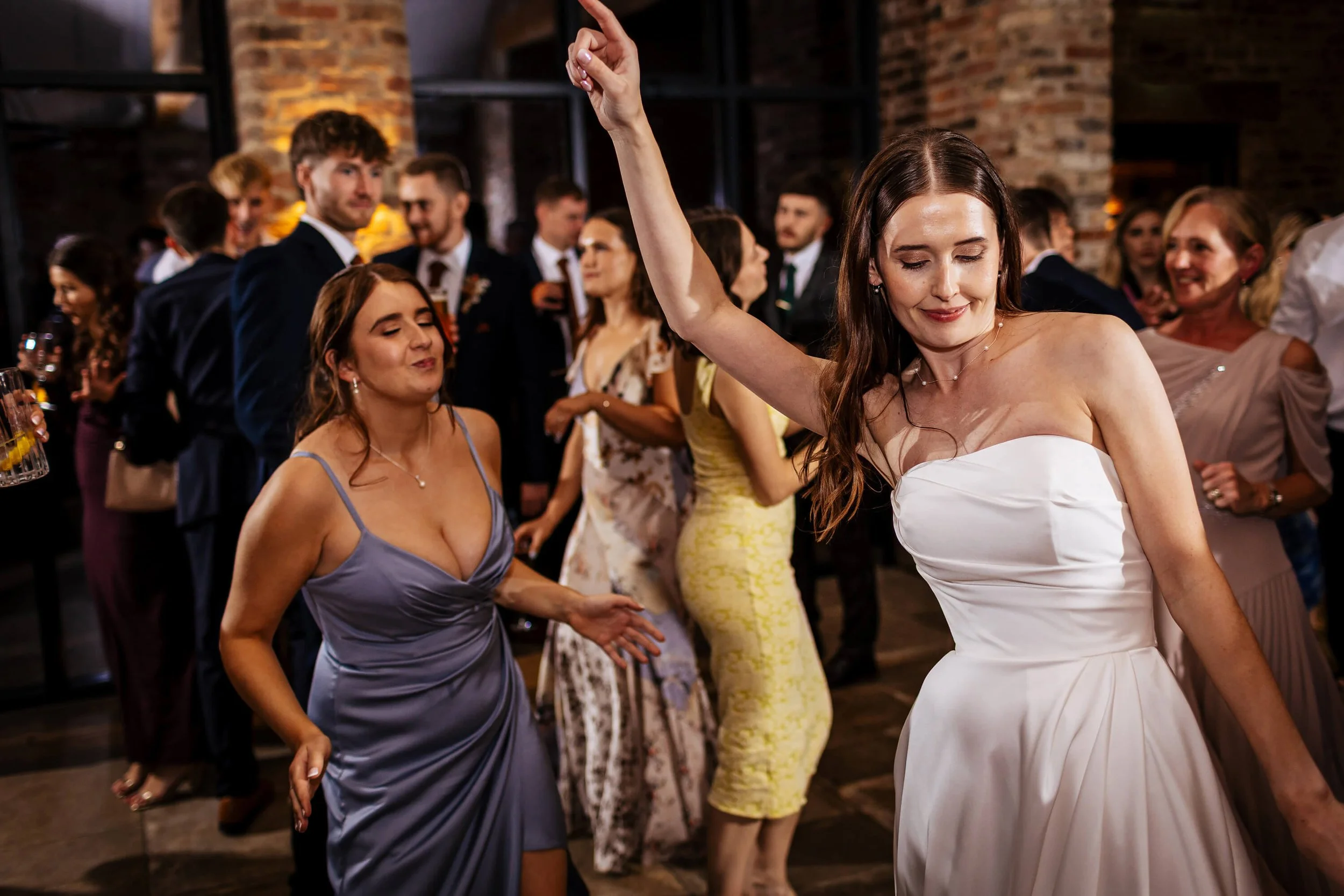 Bride strikes a pose on the dance floor at her wedding