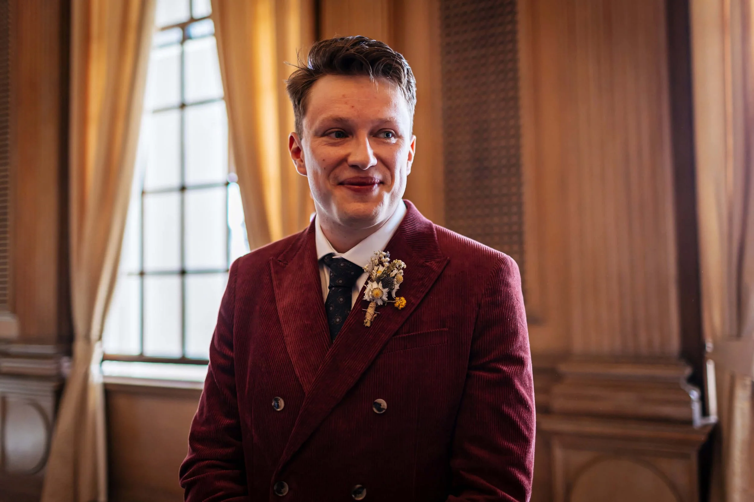 Groom awaits the arrival of his bride at the wedding