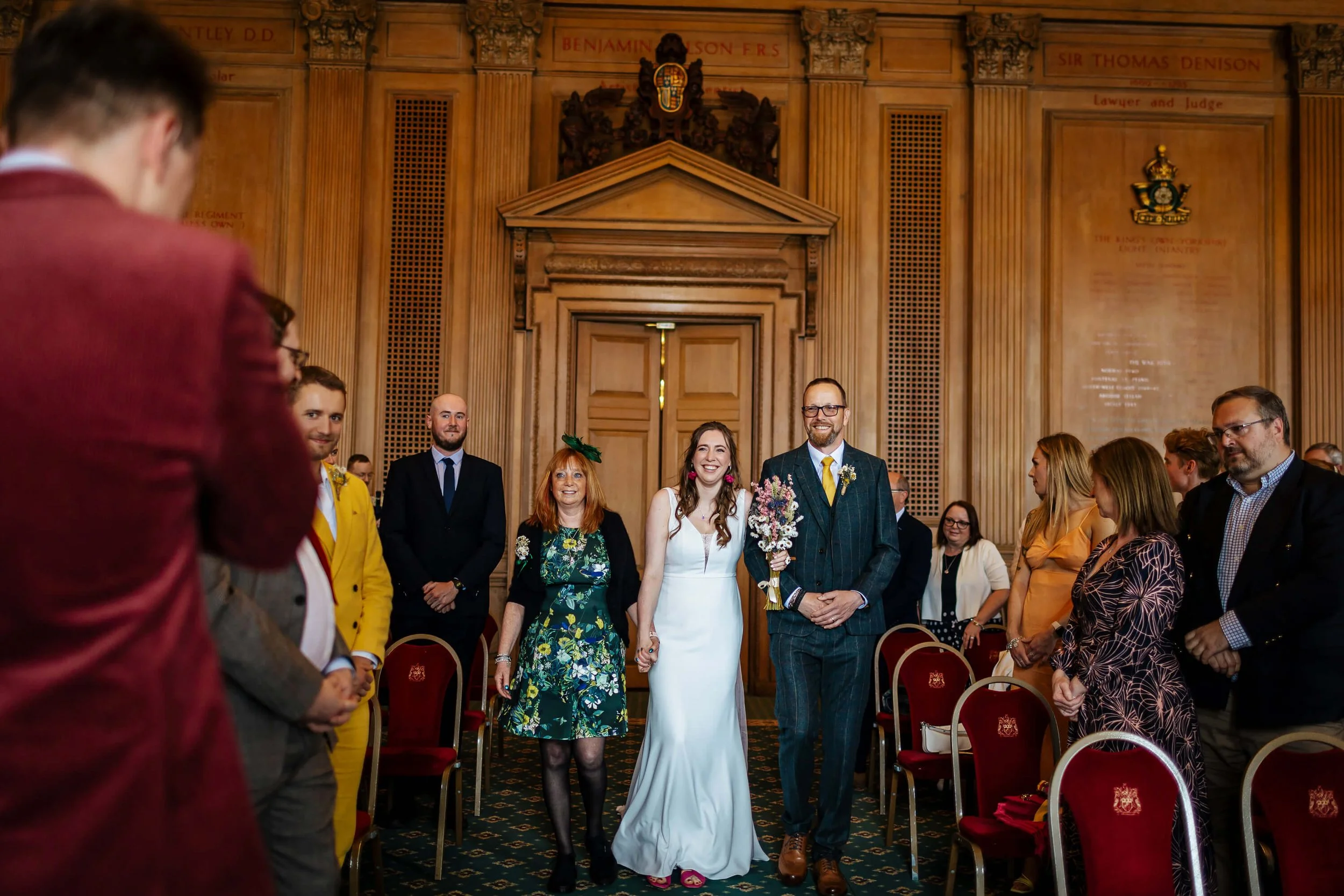 Bride and dad walk down the aisle at her wedding