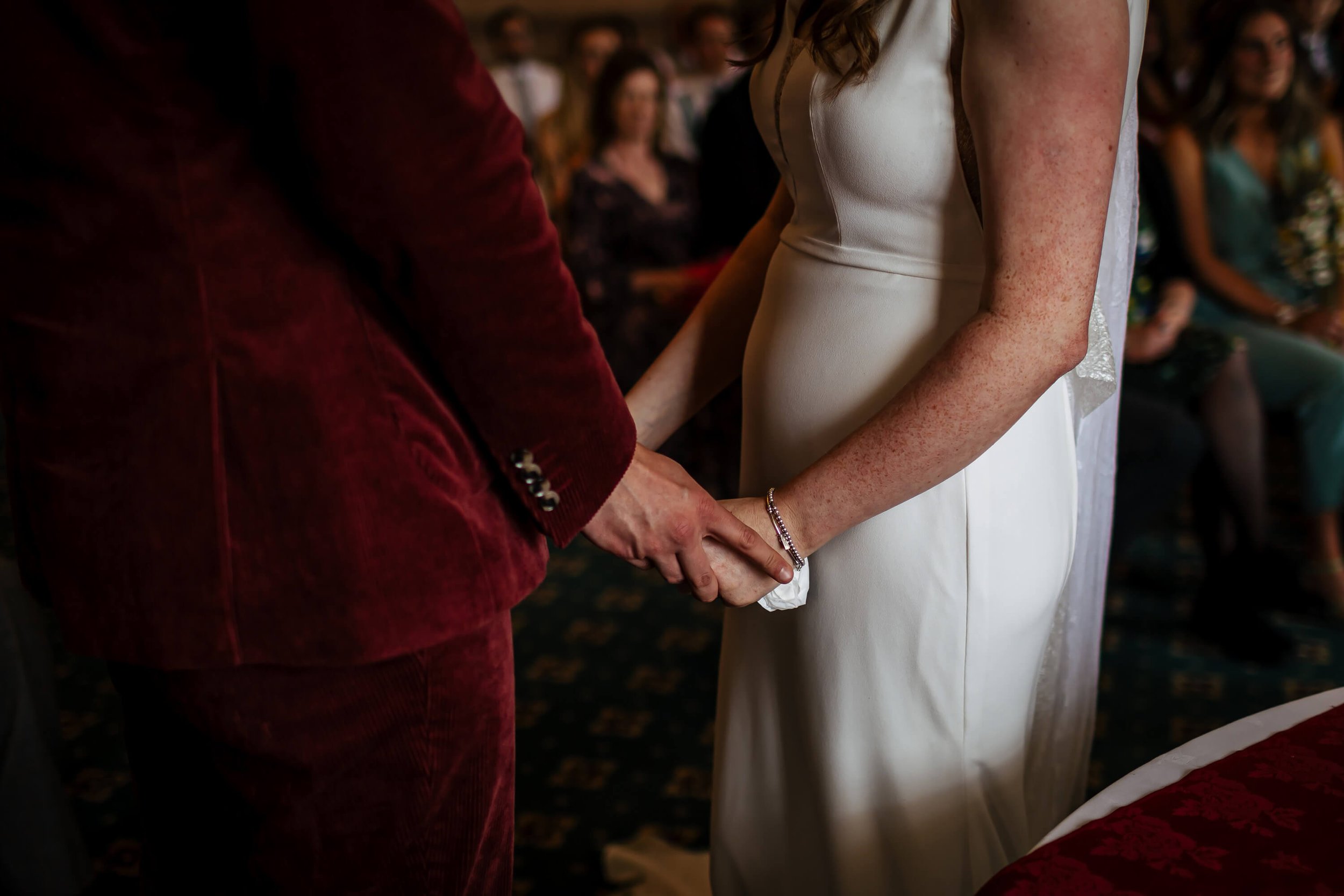 Close up of the couples hands at their wedding ceremony