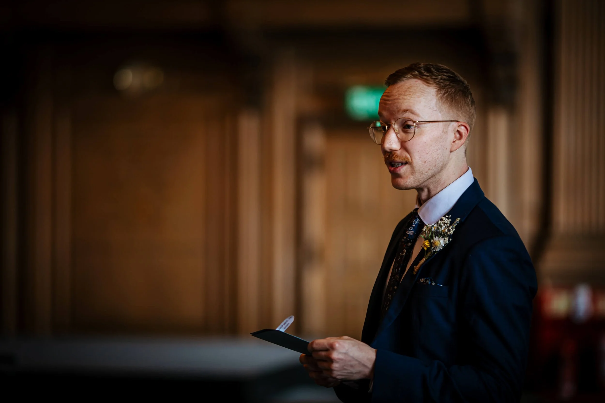 A guests performs a reading during a wedding ceremony
