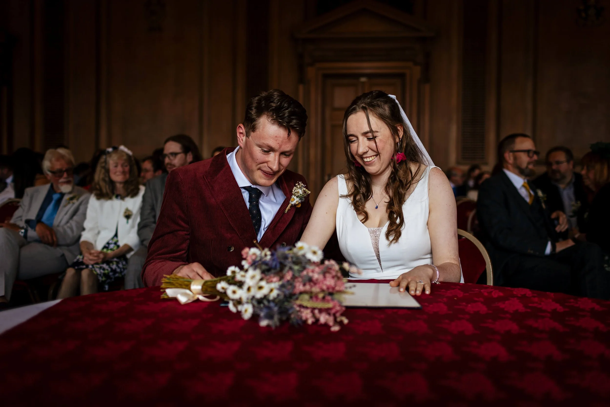 Signing the wedding register at Leeds Civic Hall