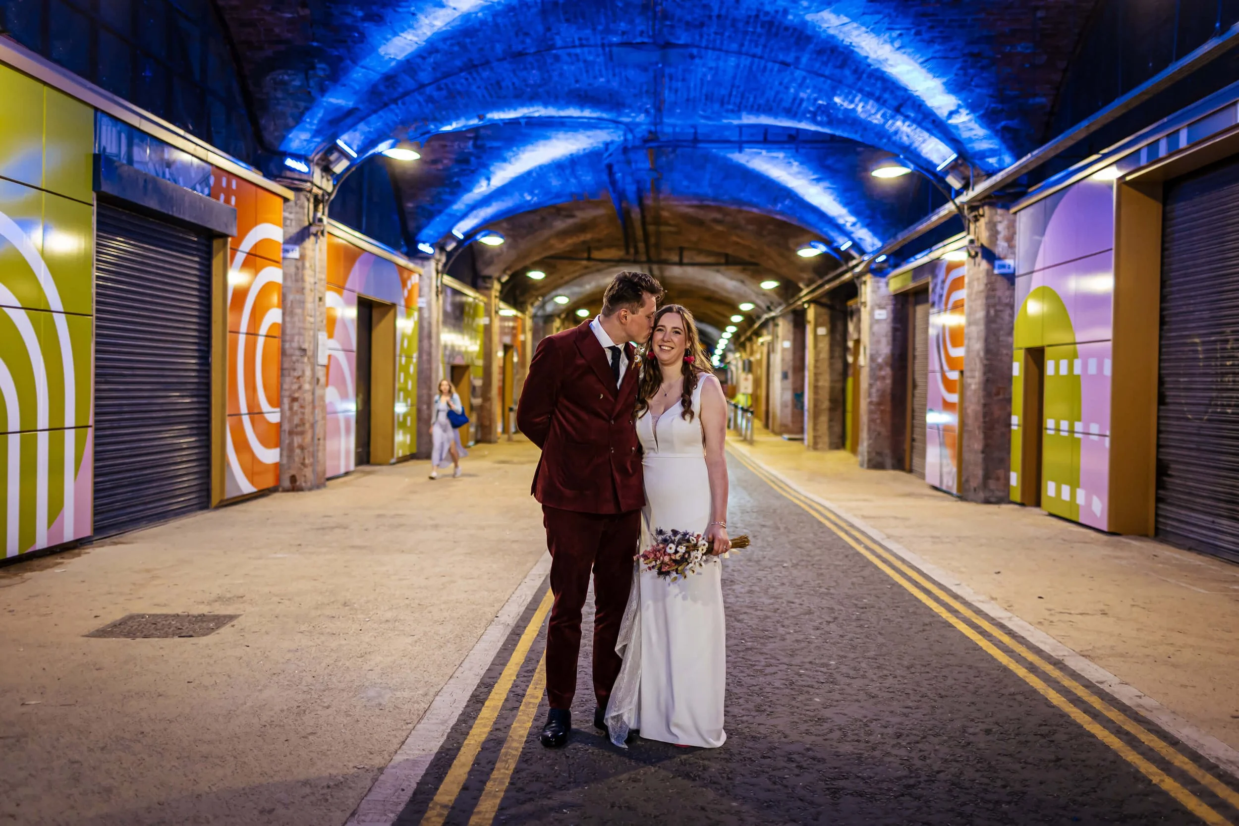 Wedding portrait under the colourful arches in Leeds city centre