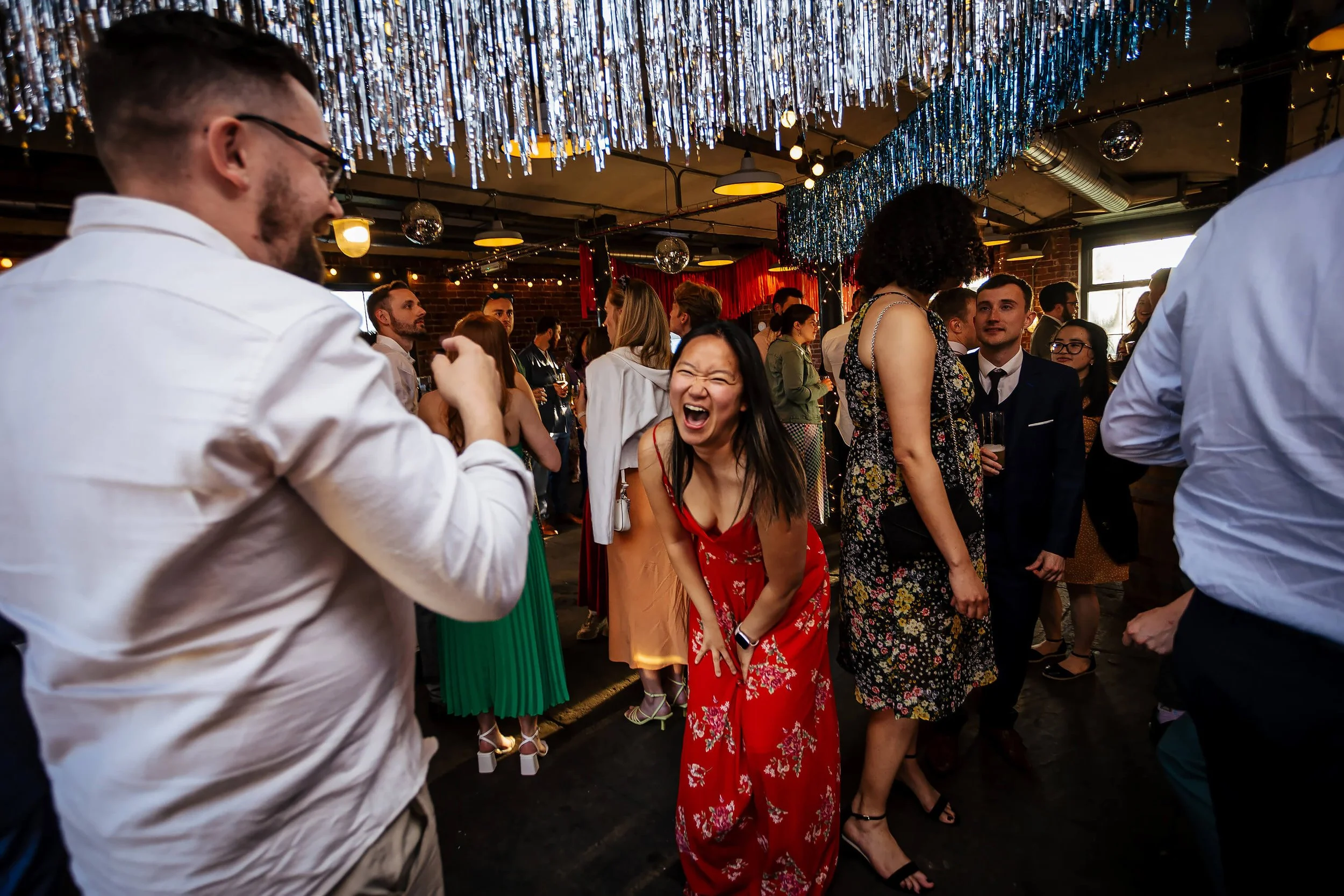 Wedding guests having fun on the dance floor