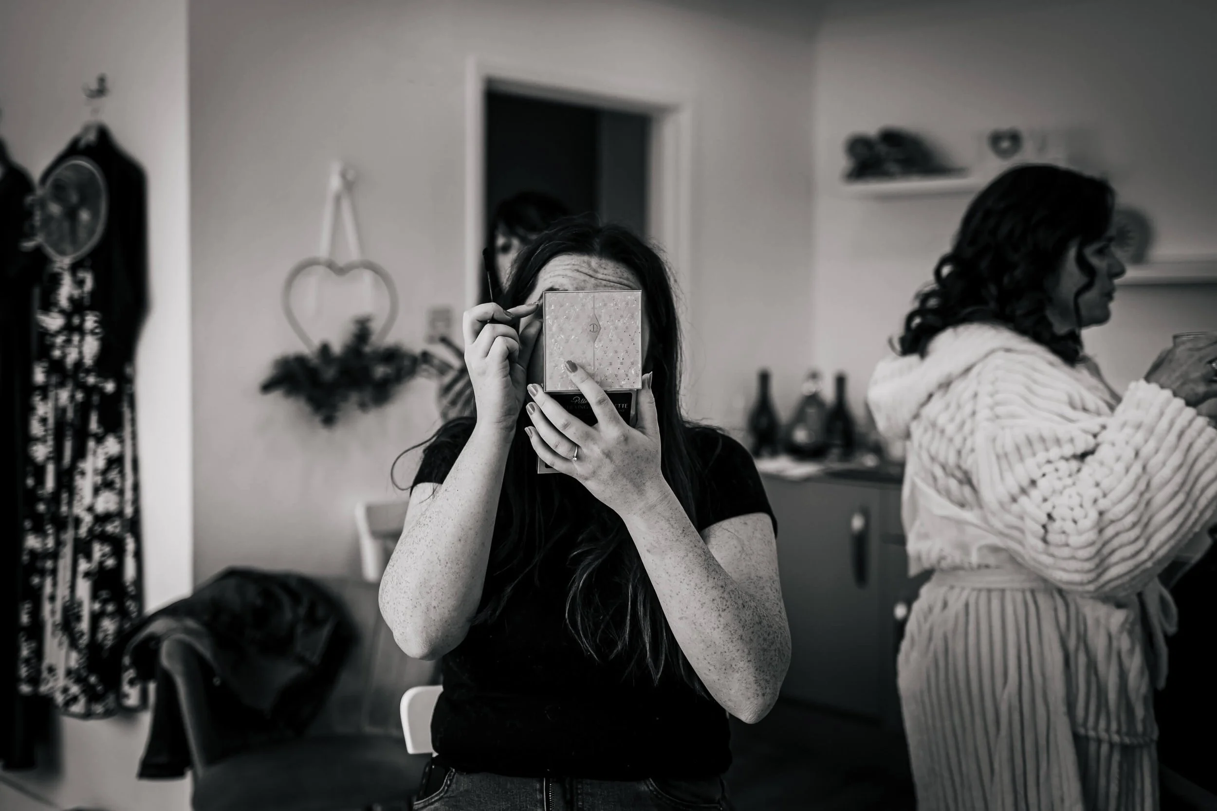 Bride putting on her makeup at Hackness Grange